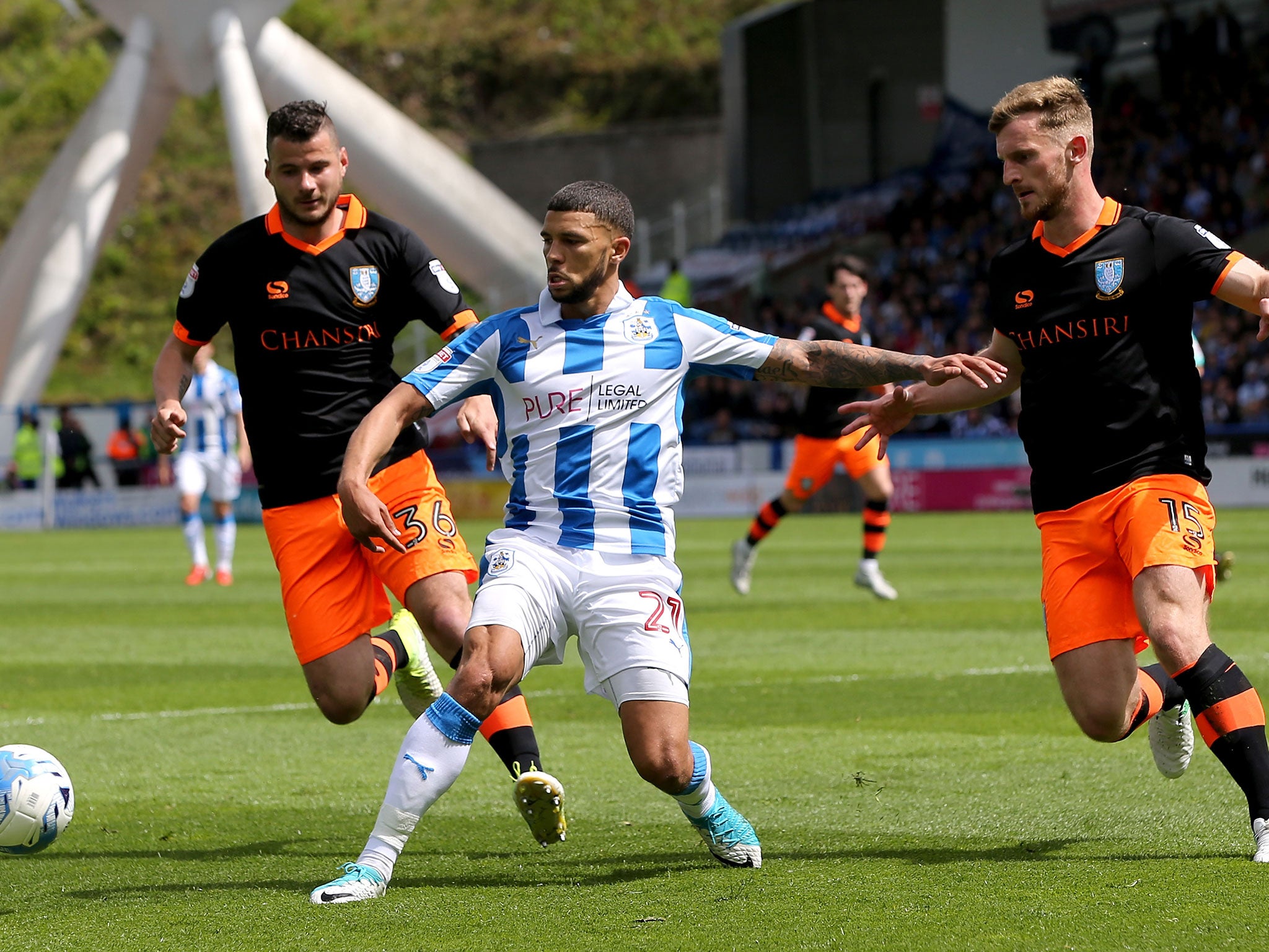 Nahki Wells is put under pressure inside the Sheffield Wednesday half