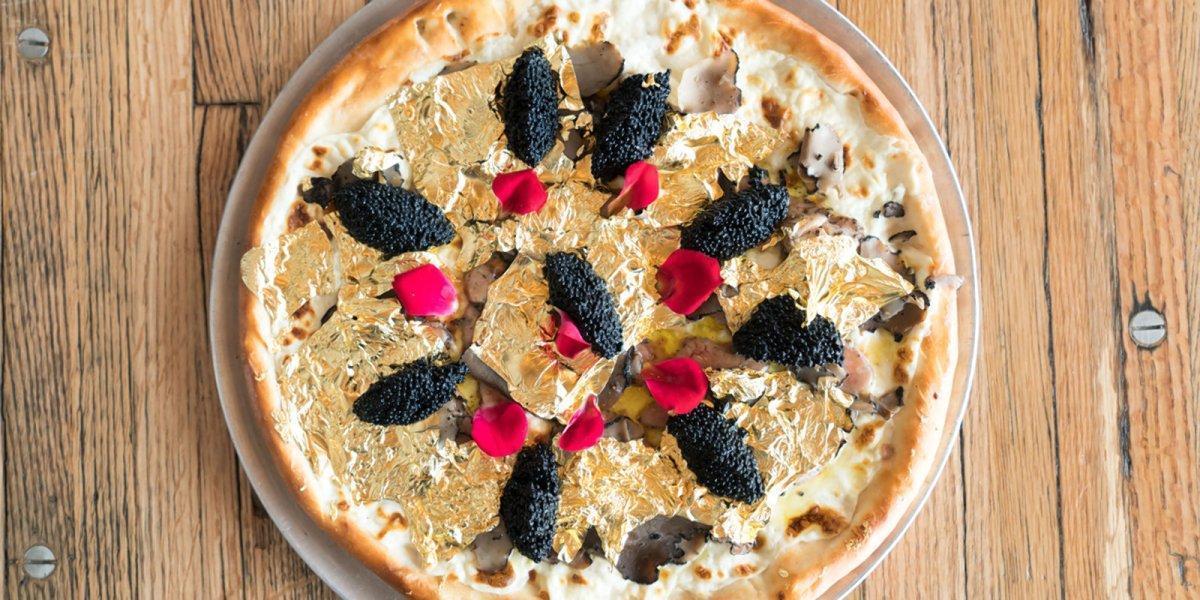 This pizza costs $400 a slice, or $50 a bite. Chew it slowly