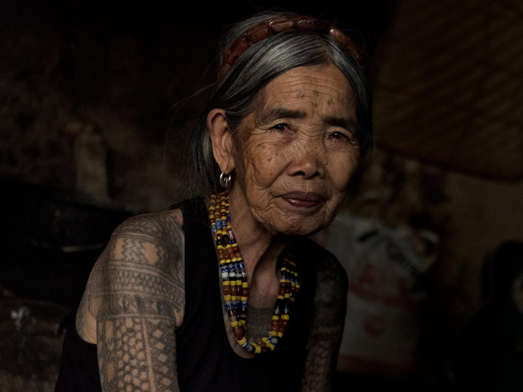 Maria Fang-od Oggay at her home in the village of Buscalan, in the northern Philippines, last week. She belongs to the last generation of her ethnic group bearing a full set of traditional tattoos and is one of the few who remember how they are done