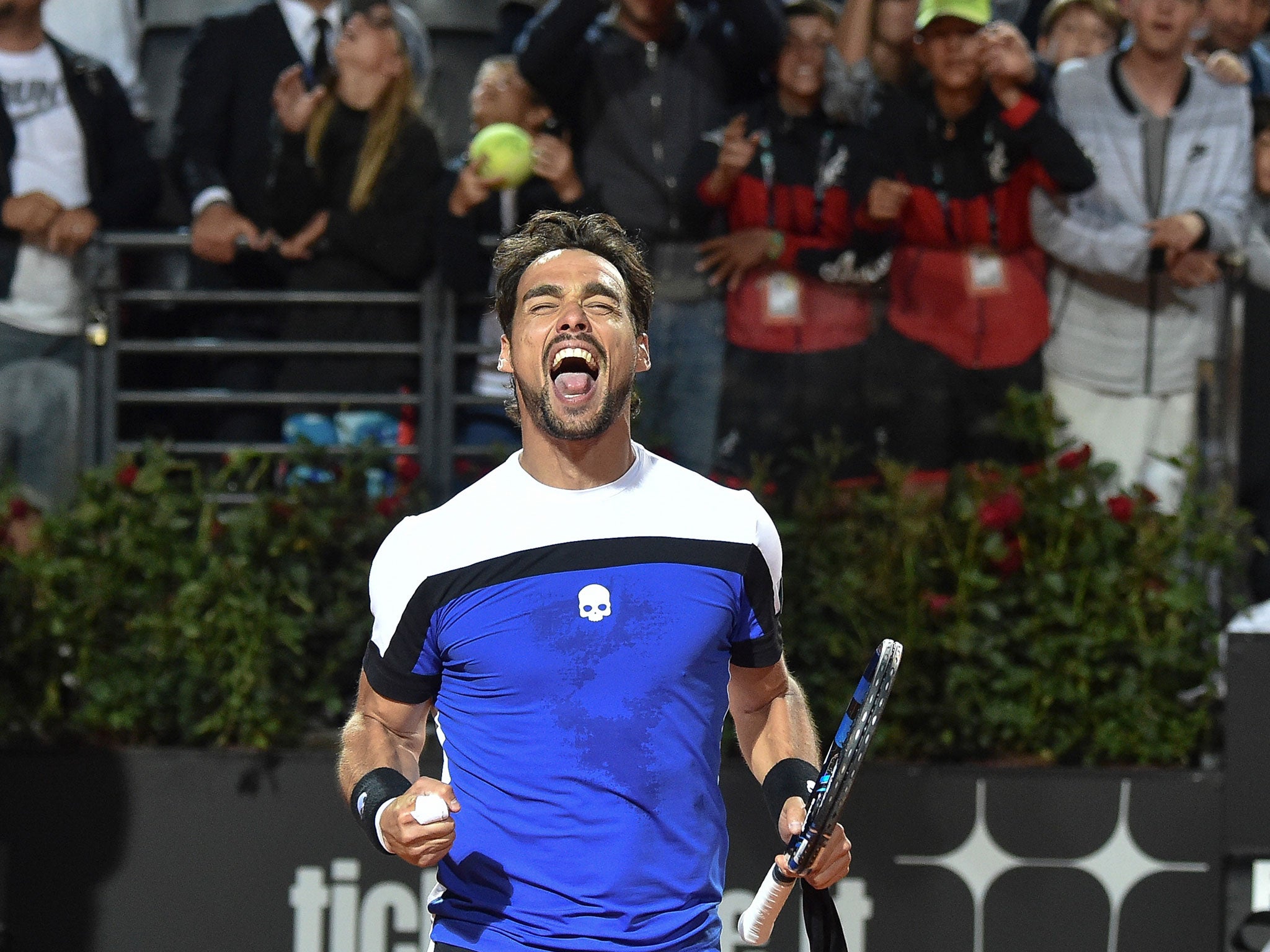 Fabio Fognini celebrates in front of his home fans after defeating Murray