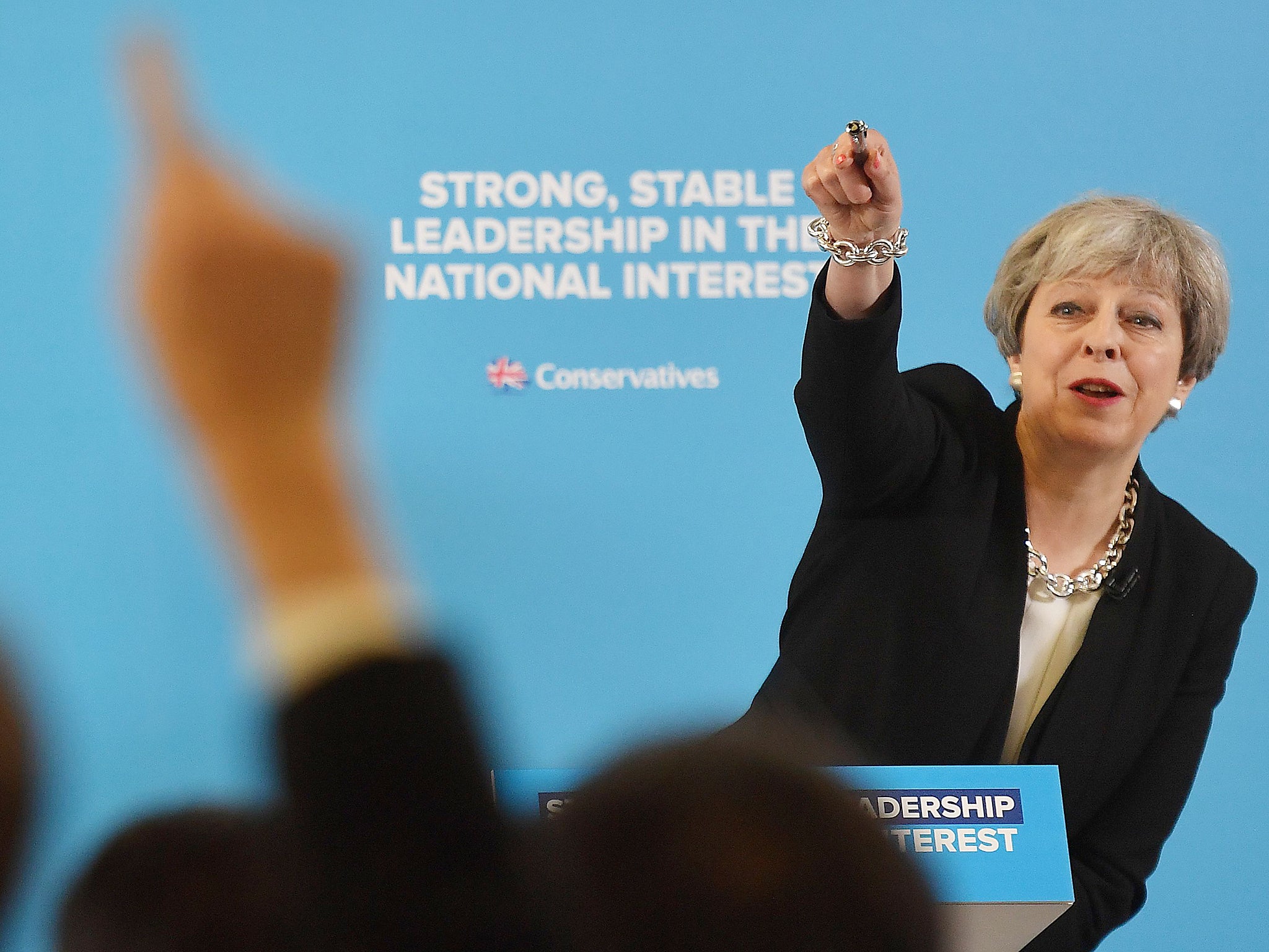 Britain's Chancellor of the Exchequer Philip Hammond (L) and Britain's Prime Minister Theresa May attend an election campaign event in Canary Wharf
