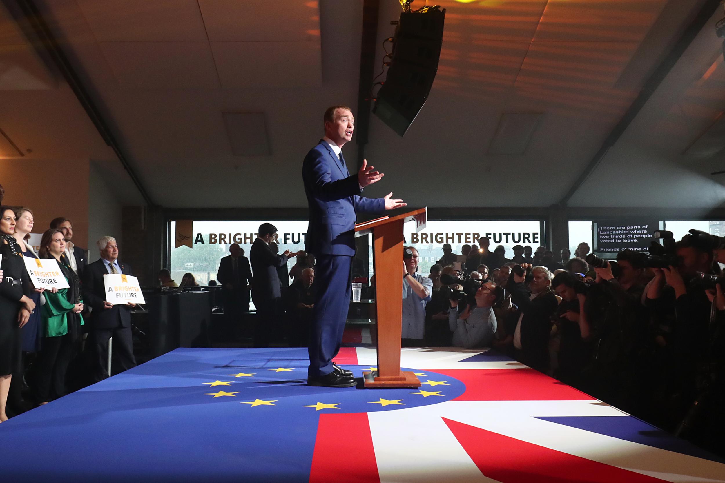 Mr Farron spoke from within a circumference of European stars inside a hollowed out Union Jack