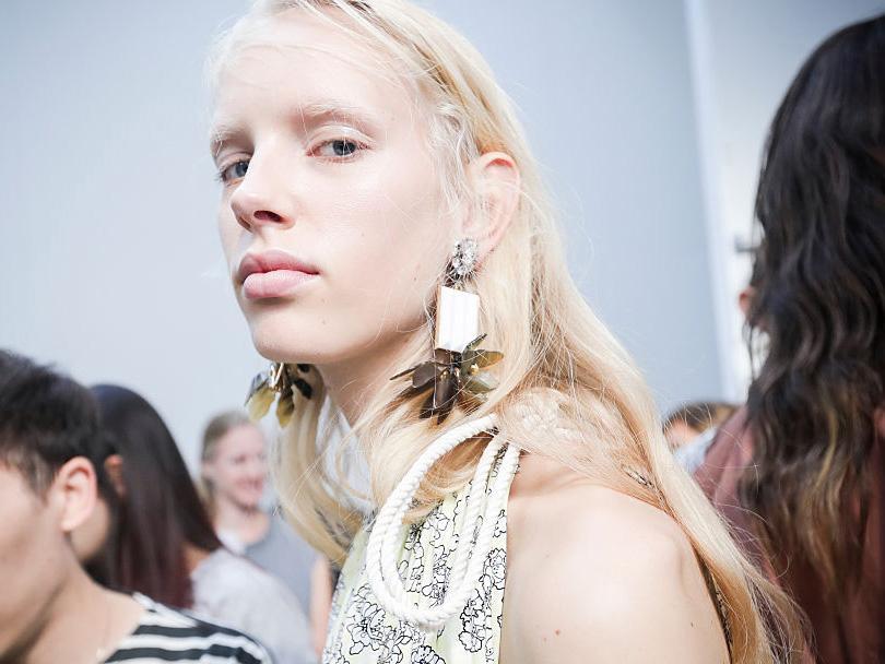 The models were given a high-shine finish with dewy skin at Marni