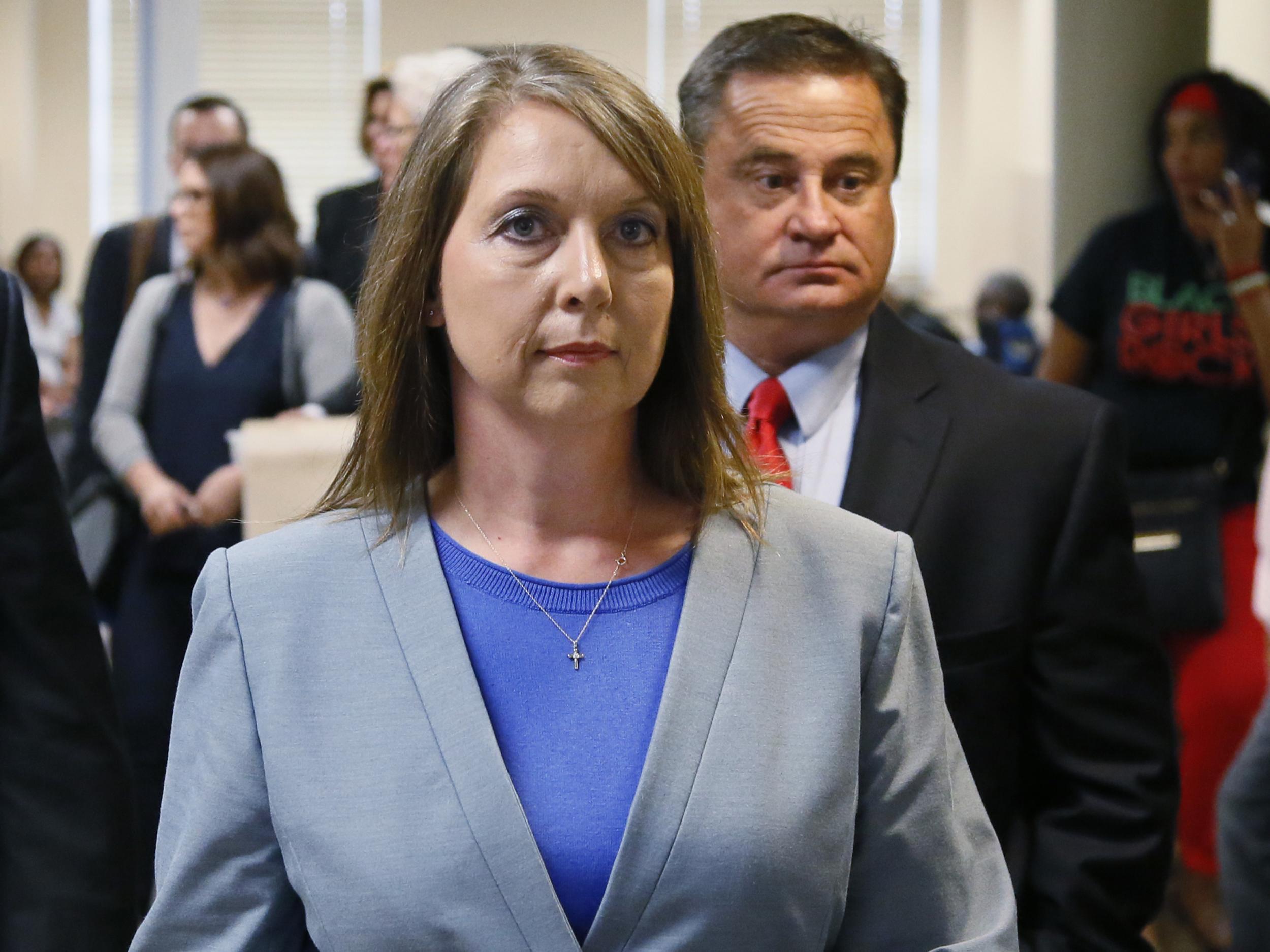 Betty Shelby leaves the courtroom