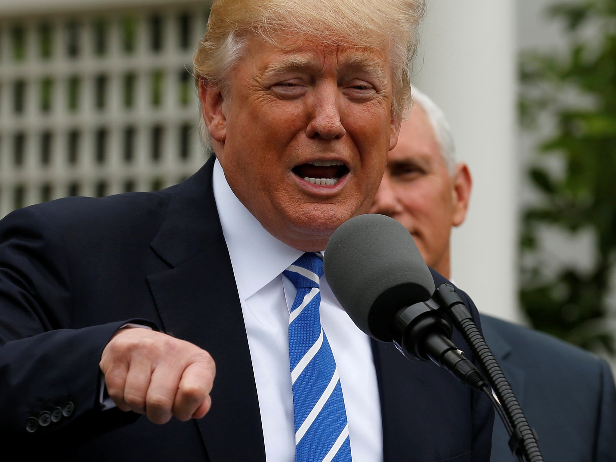 US President Donald Trump, flanked by Vice President Mike Pence