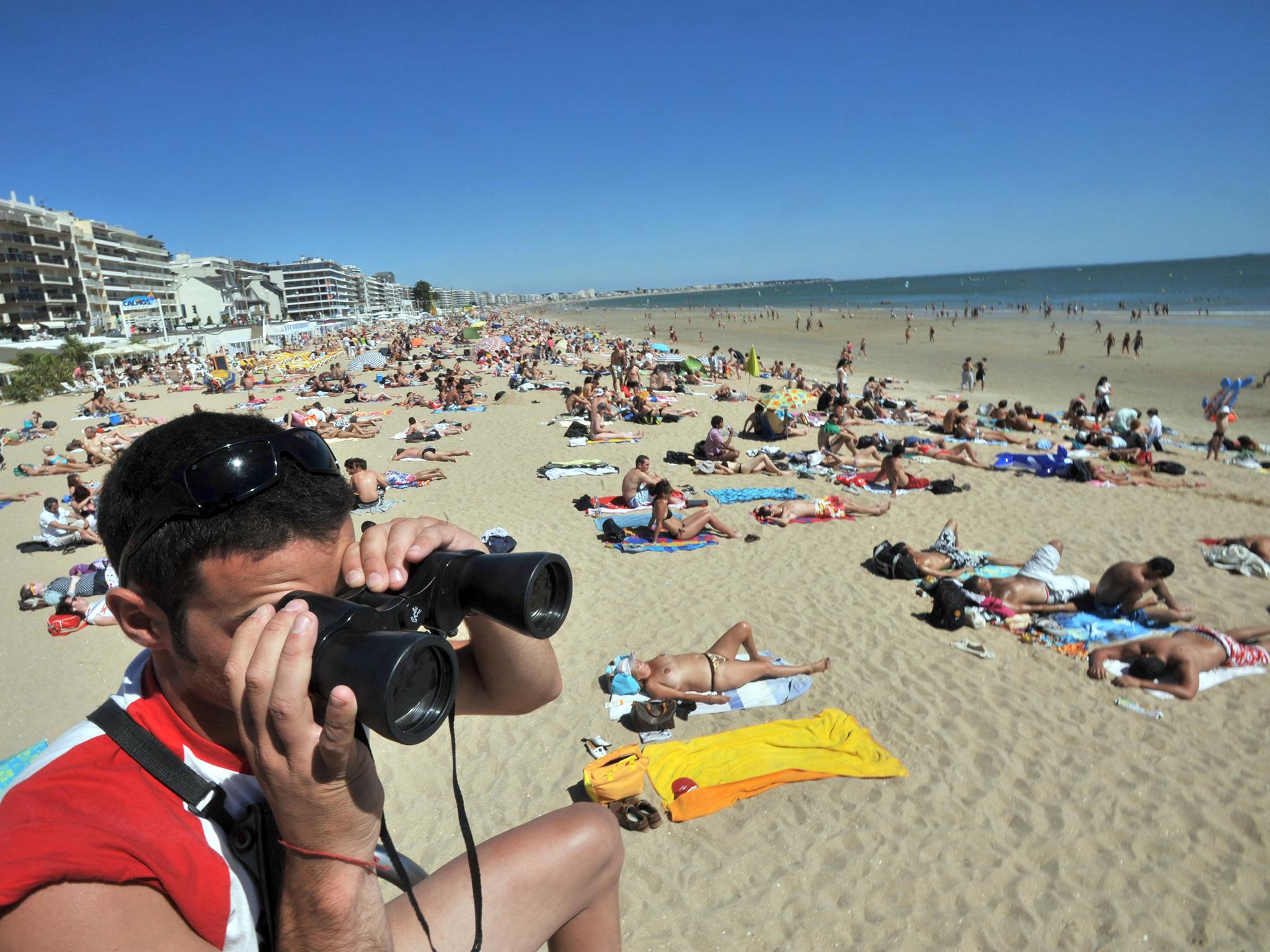 A lifeguard looks out over La Baule beach