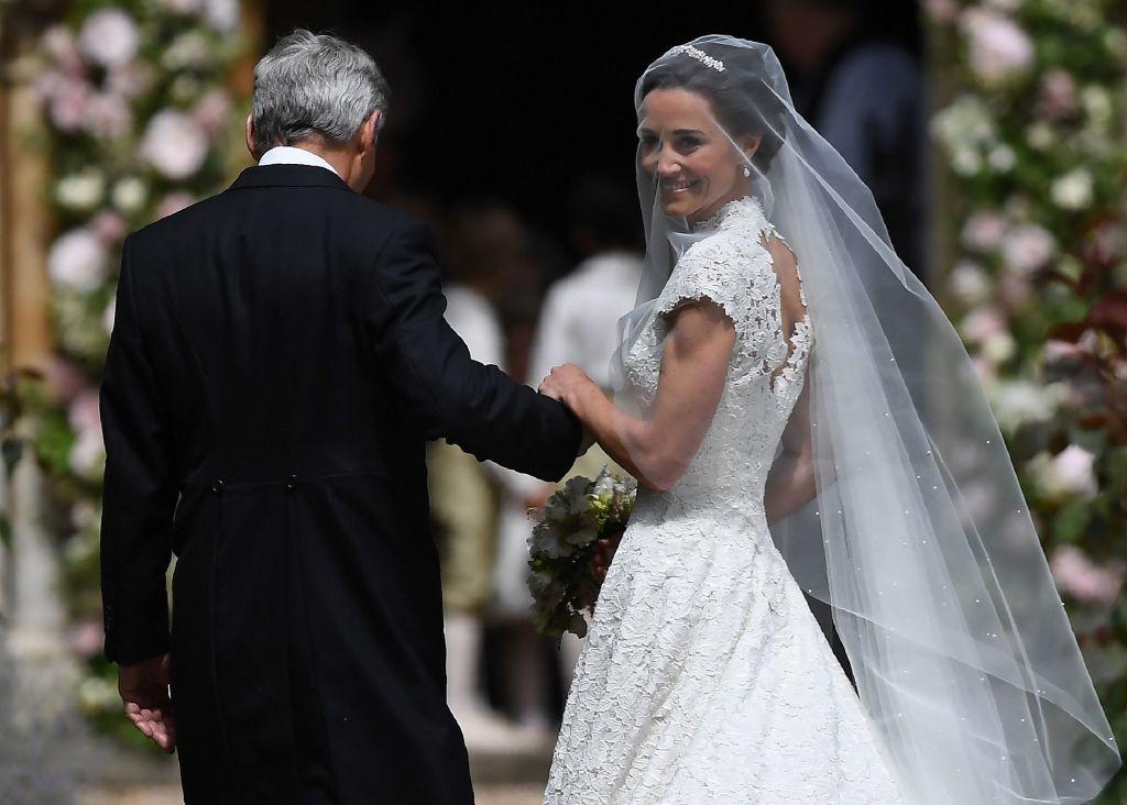 Pippa Middleton is escorted into the church by her father