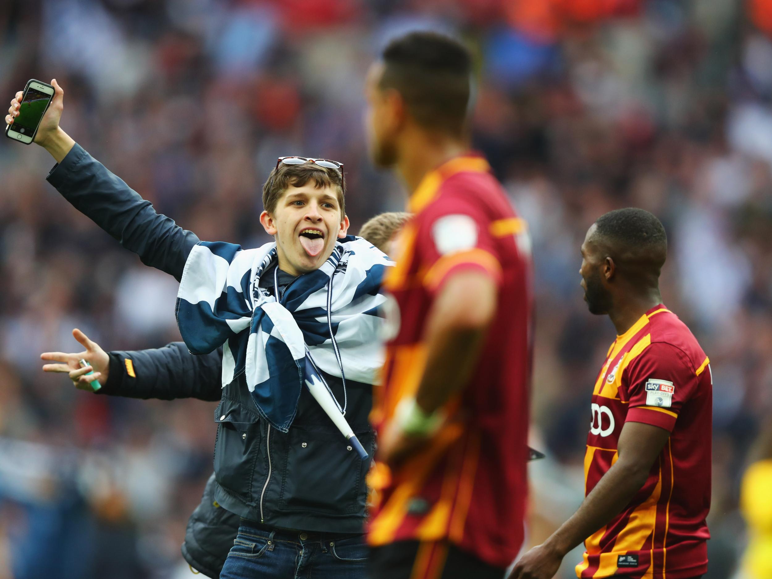 Millwall supporters stormed onto the pitch at the final whistle