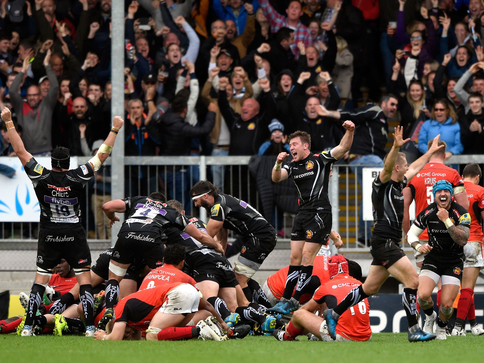 Exeters' players celebrate after their late try