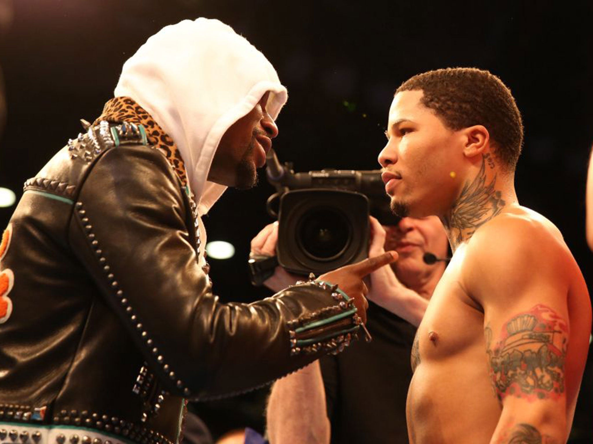 Mayweather speaks with young protege Gervonta Davis during his fight with Liam Walsh