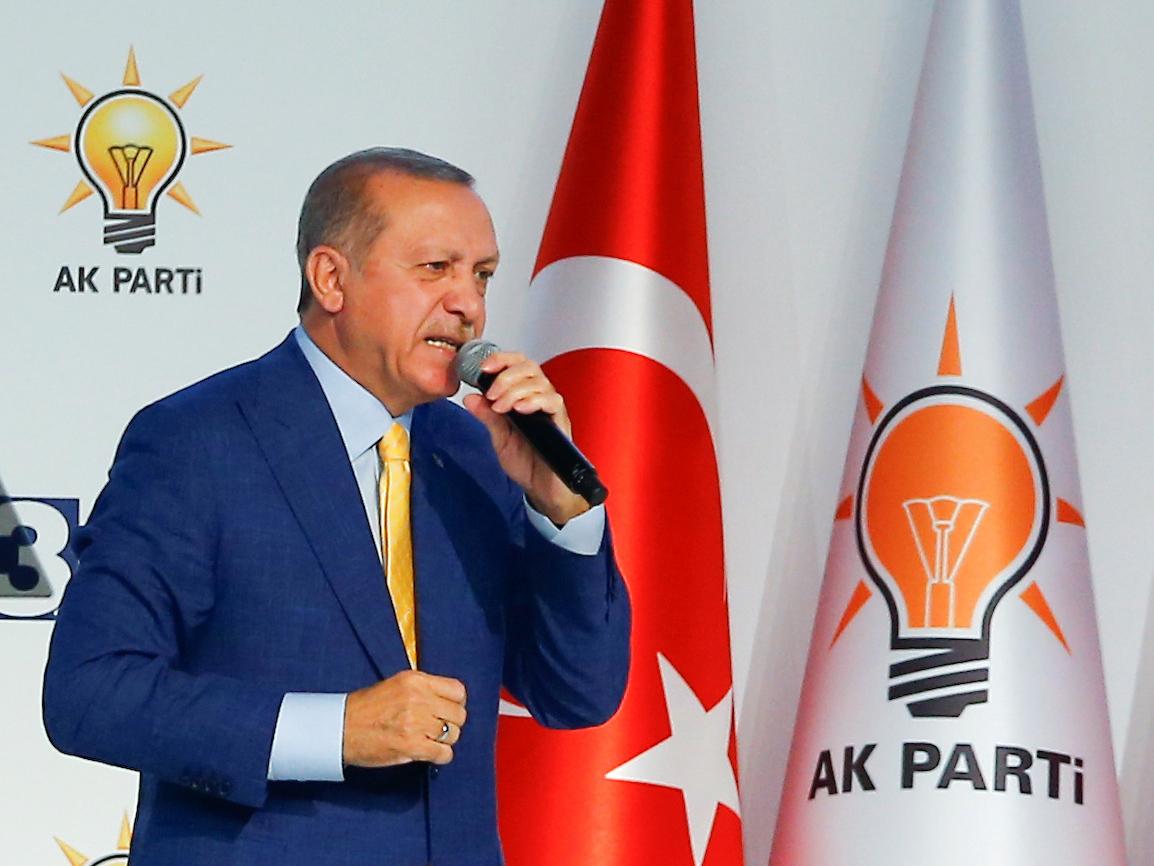 Turkish President Recep Tayyip Erdogan makes a speech during the Extraordinary Congress of the ruling AK Party in Ankara on 21 May 2017