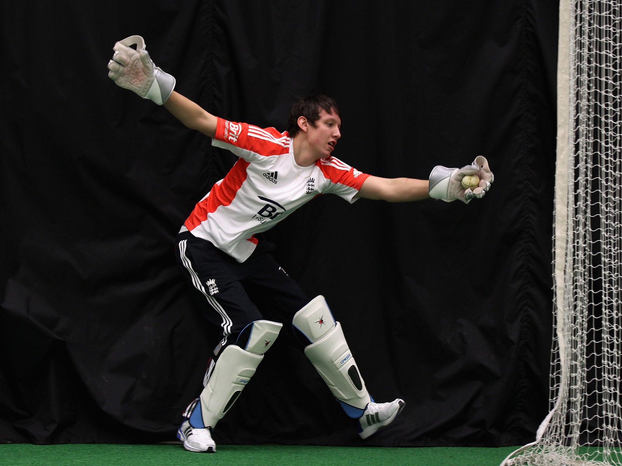 Liam Thomas in action wicket keeping during a training session