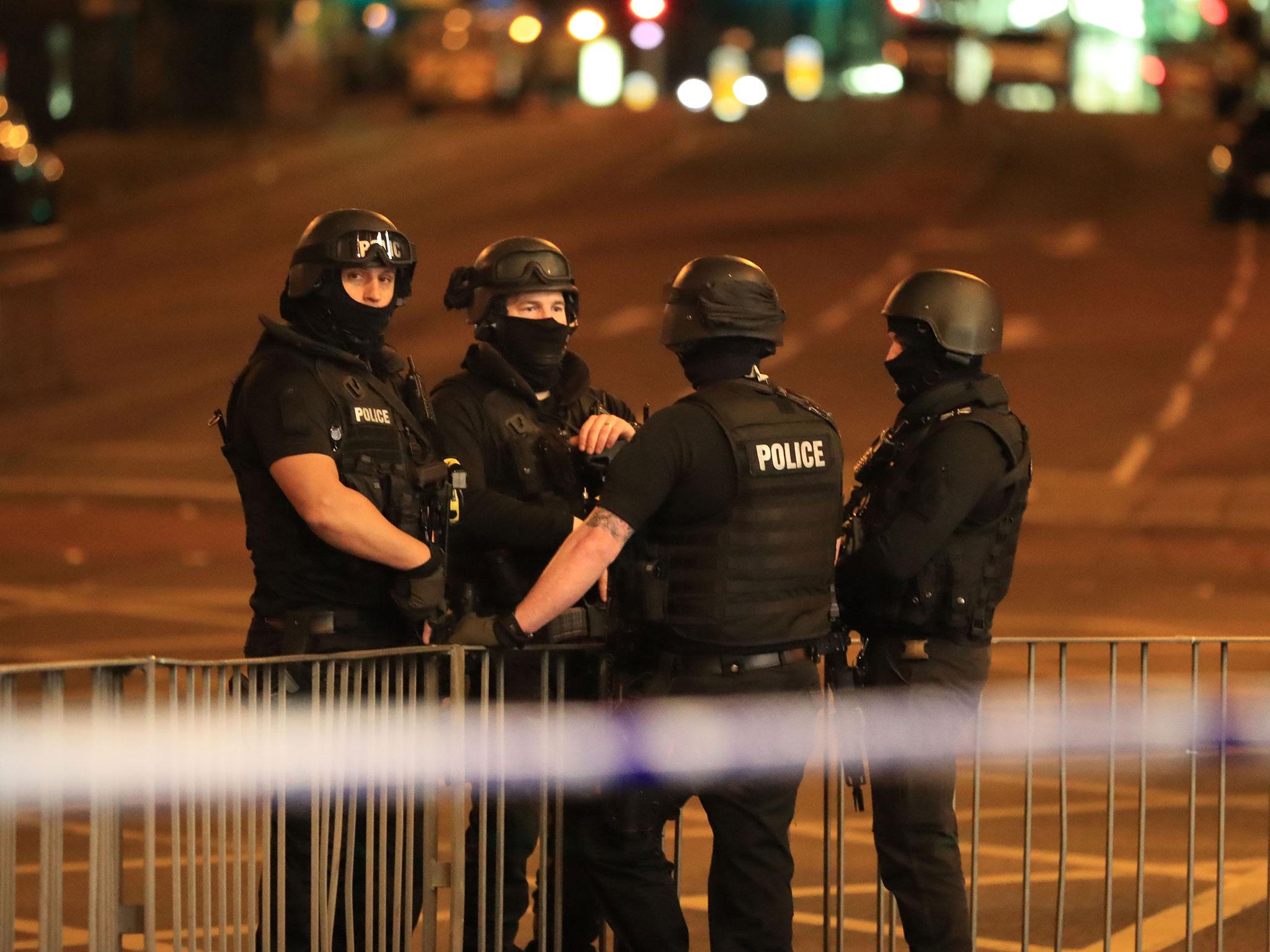 Armed police at Manchester Arena after an explosion at the venue during an Ariana Grande gig