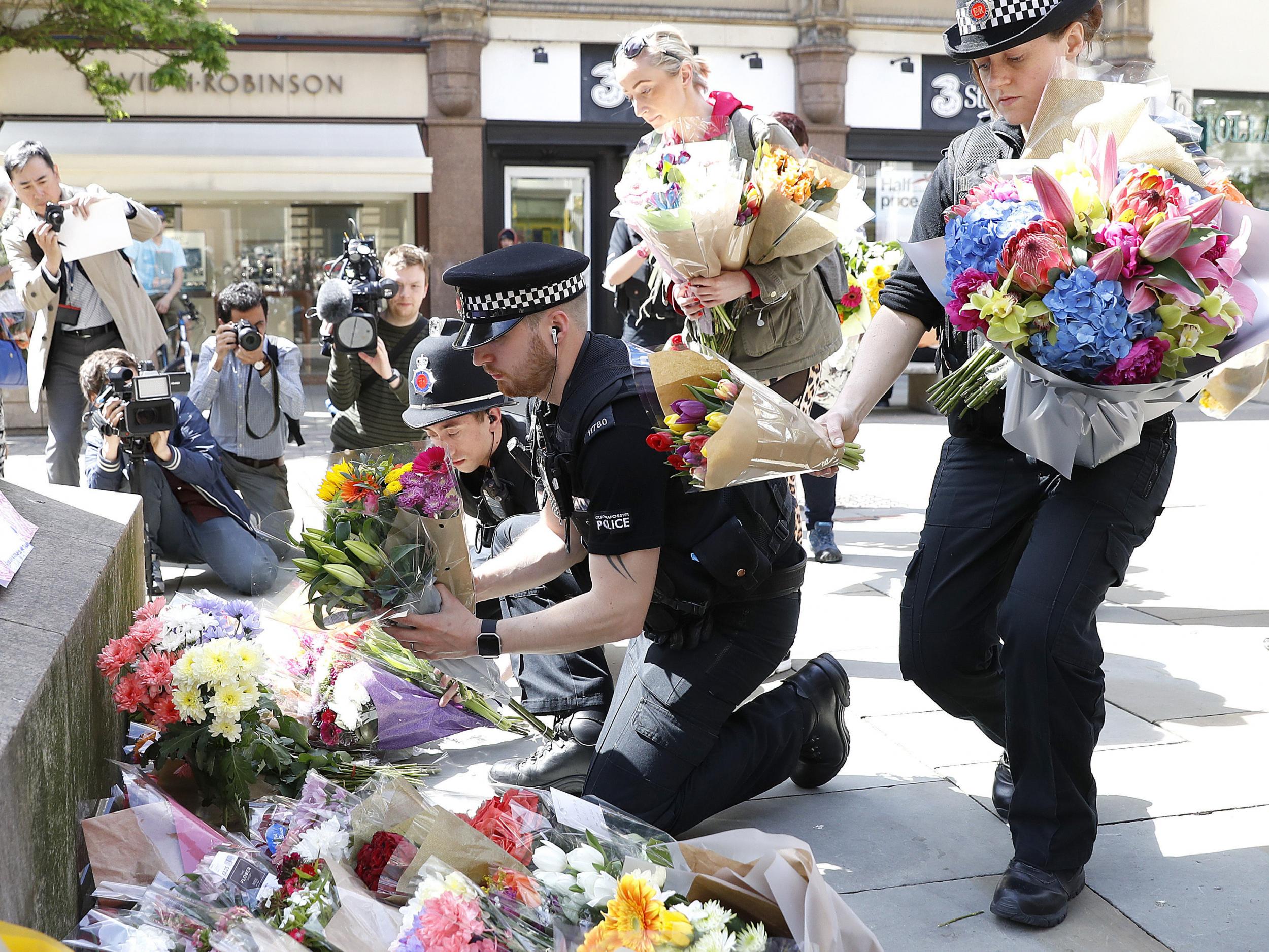 &#13;
Flowers are left in St Ann's Square, Manchester, the day after a suicide bomber killed 22 people, including children (PA)&#13;