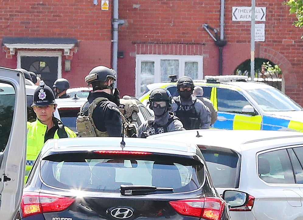 Police at the Abedis' family home following the bombing