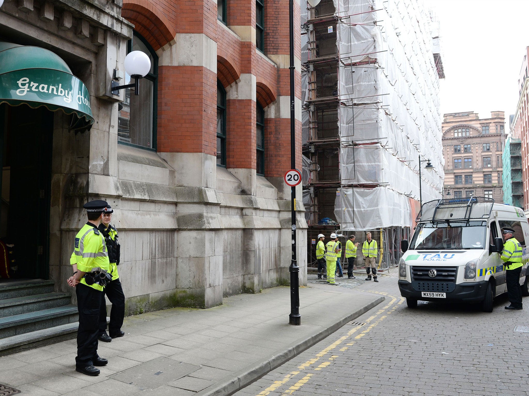 Police outside Granby House in Granby Row, which was raided by armed police