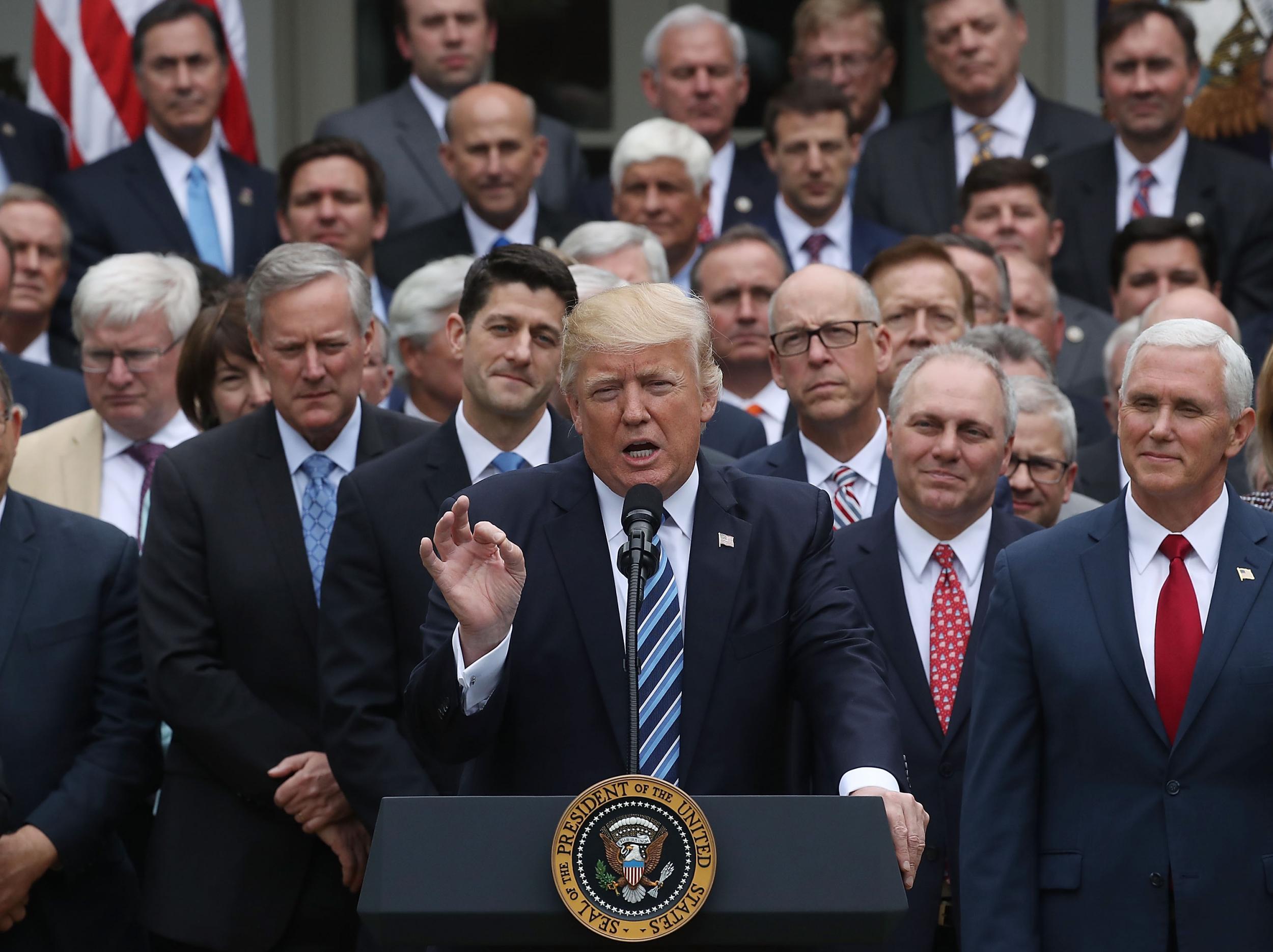 Donald Trump and House Republicans celebrate after passing legislation aimed at repealing and replacing ObamaCare