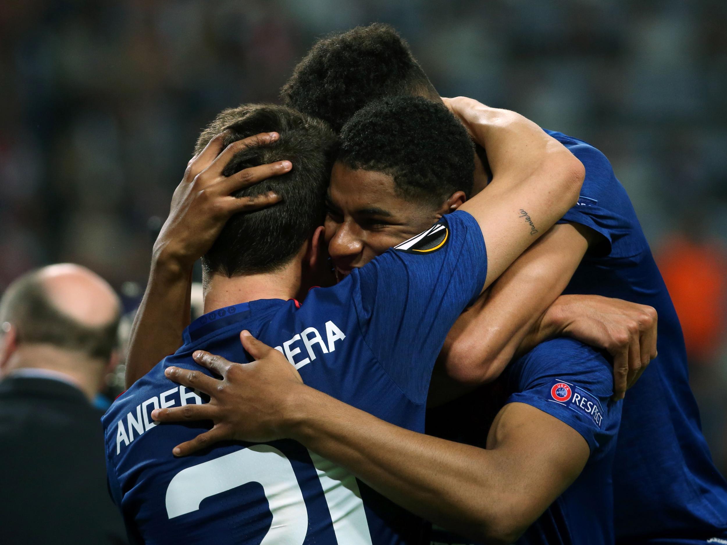 Rashford and Herrera embrace upon the full-time whistle