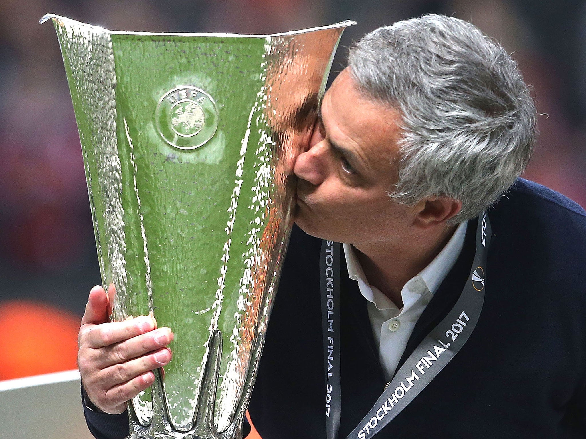 Jose Mourinho kisses the Europa League trophy as United's celebrations begin