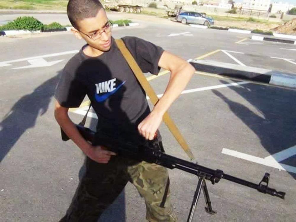 The brother of Salman Abedi, Ismail, poses for a picture with a machine gun