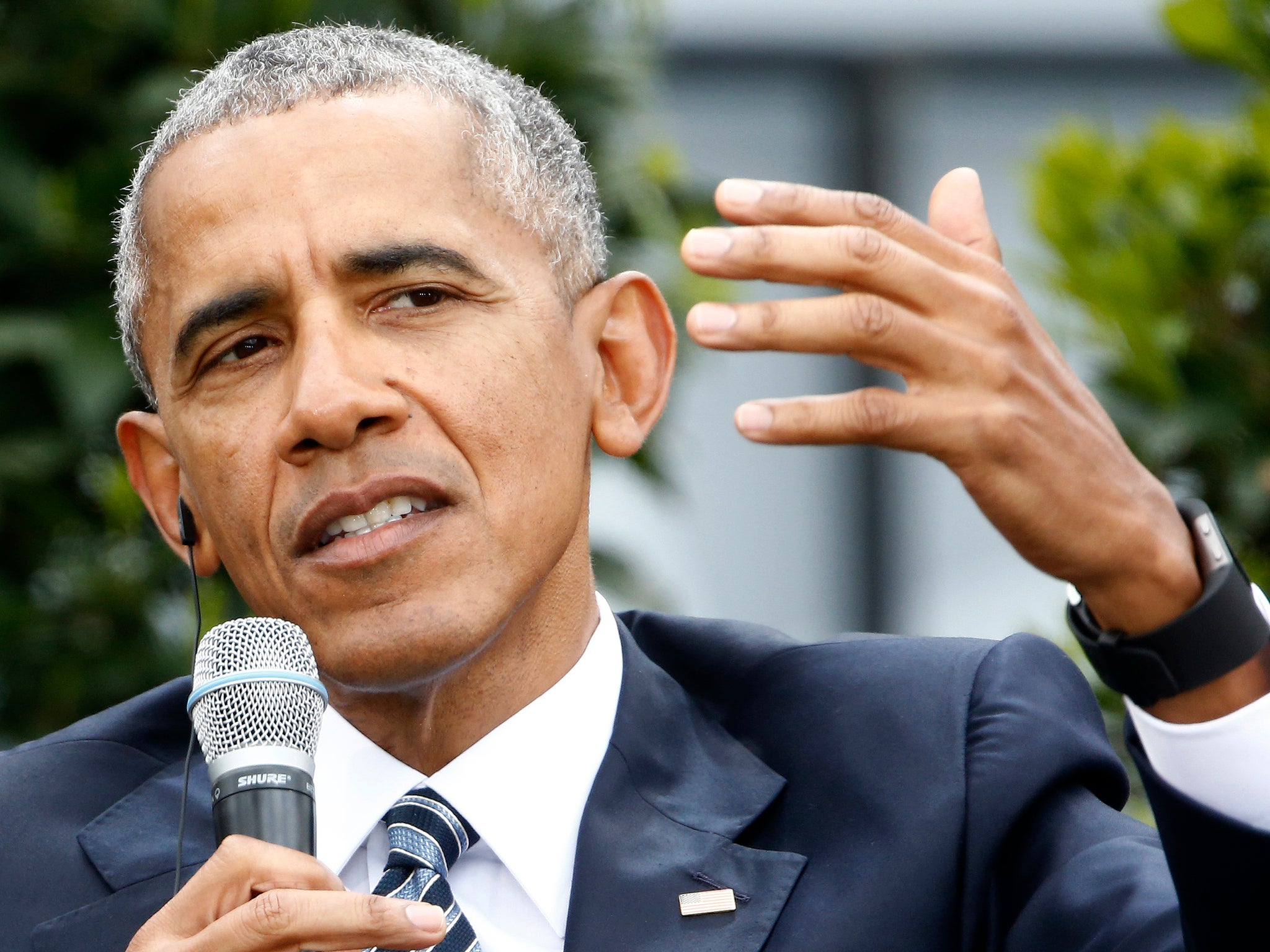 Barack Obama speaks during a discussion at the German Protestant Kirchentag in front of the Brandenburg Gate in Berlin, Germany