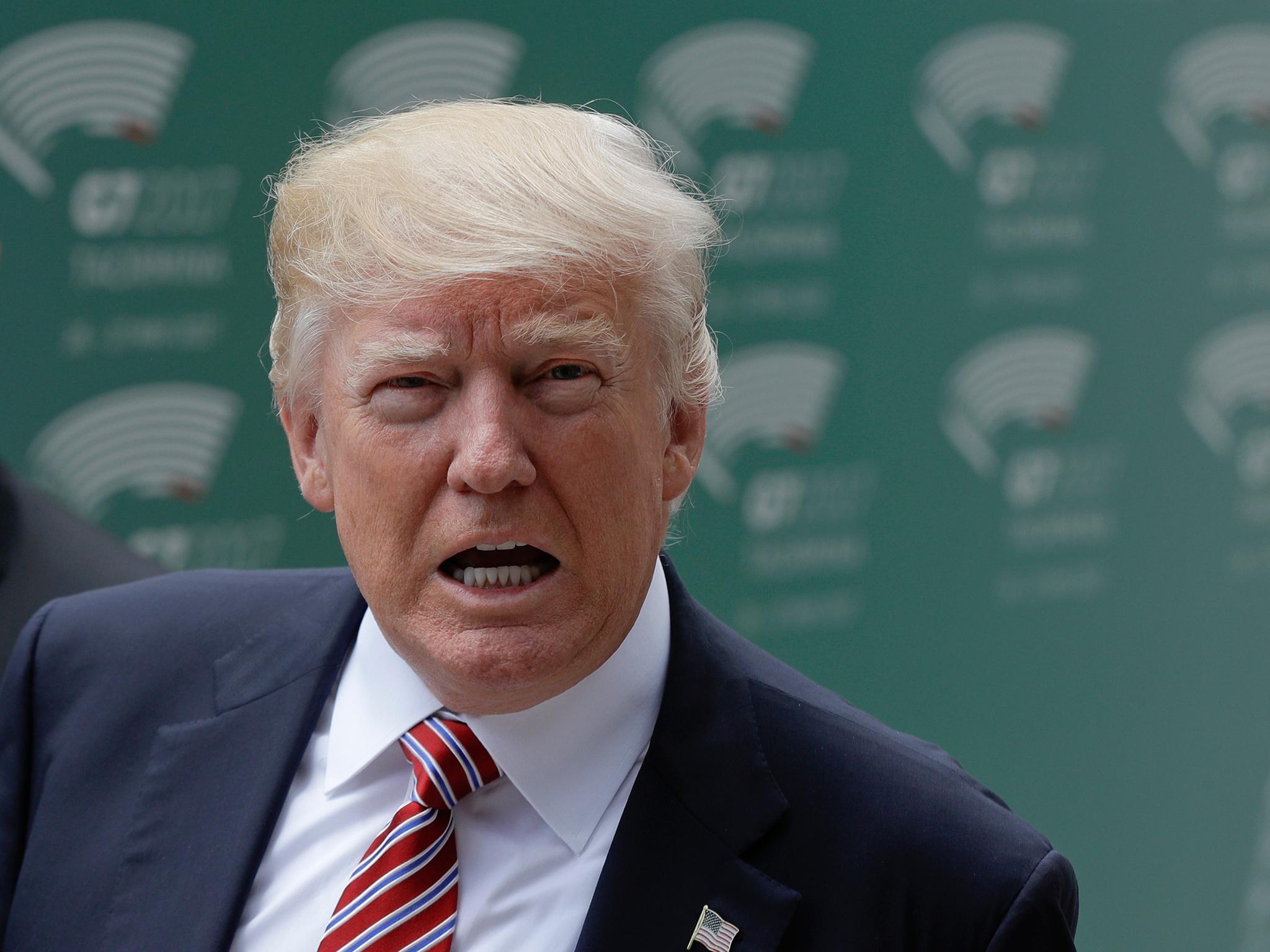 US President Donald Trump arrives for a welcome ceremony for the G7 summit in the Ancient Theatre of Taormina