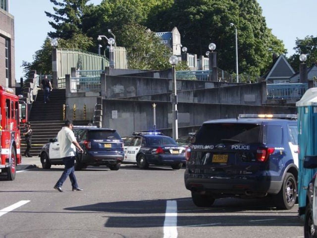 Police at the scene of the triple stabbing in northeast Portland