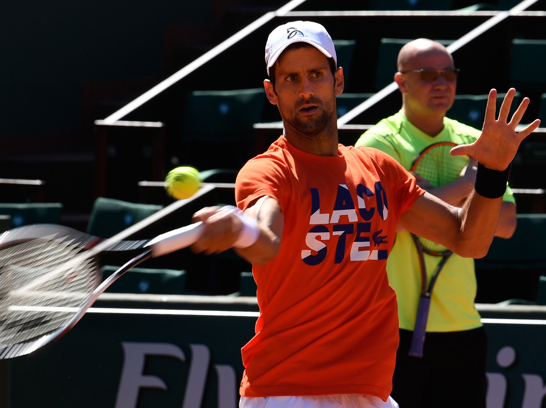 Djokovic watched on by his new coach, Andre Agassi