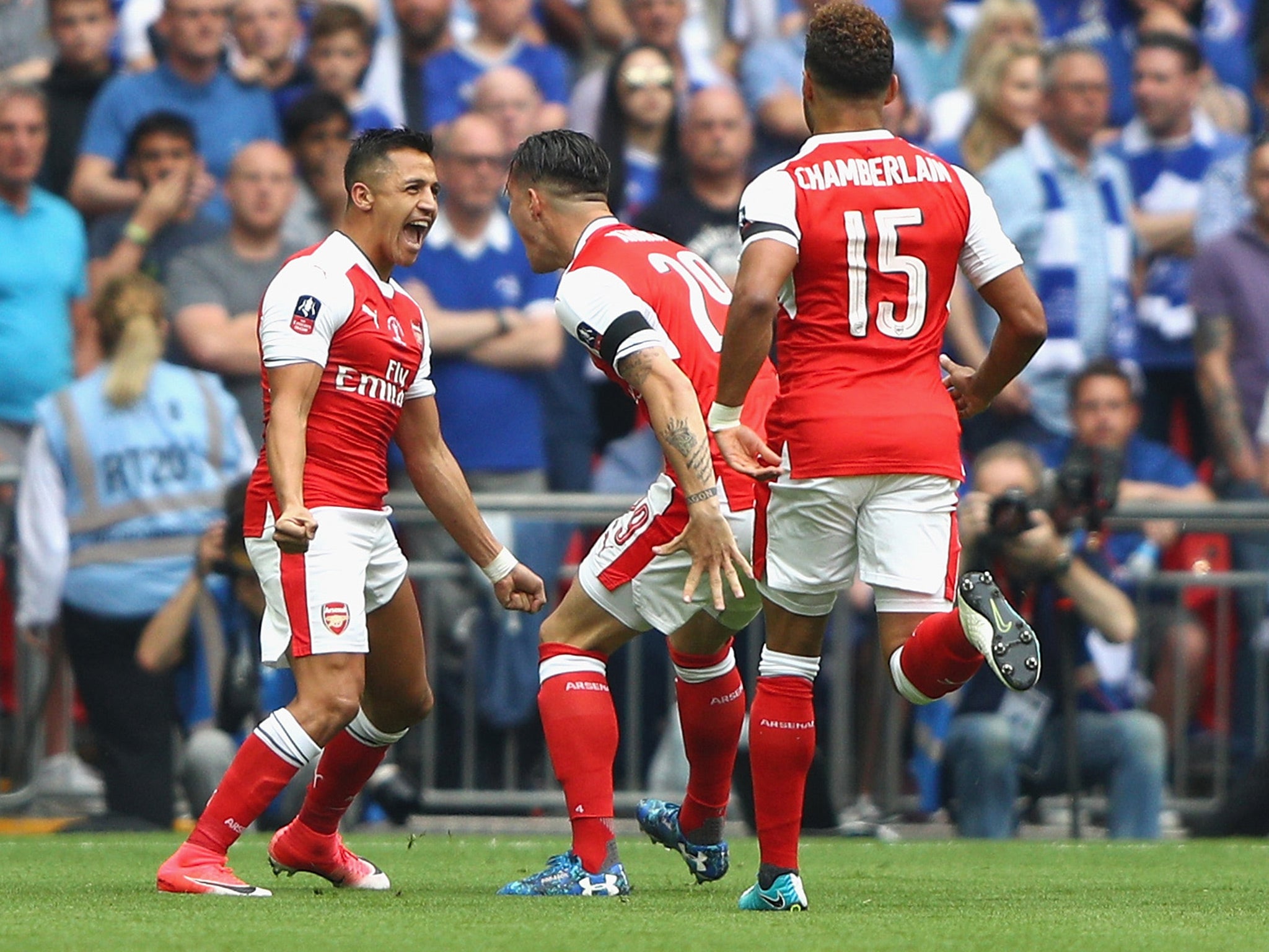 Alexis Sanchez celebrates putting Arsenal ahead in controversial circumstances early on