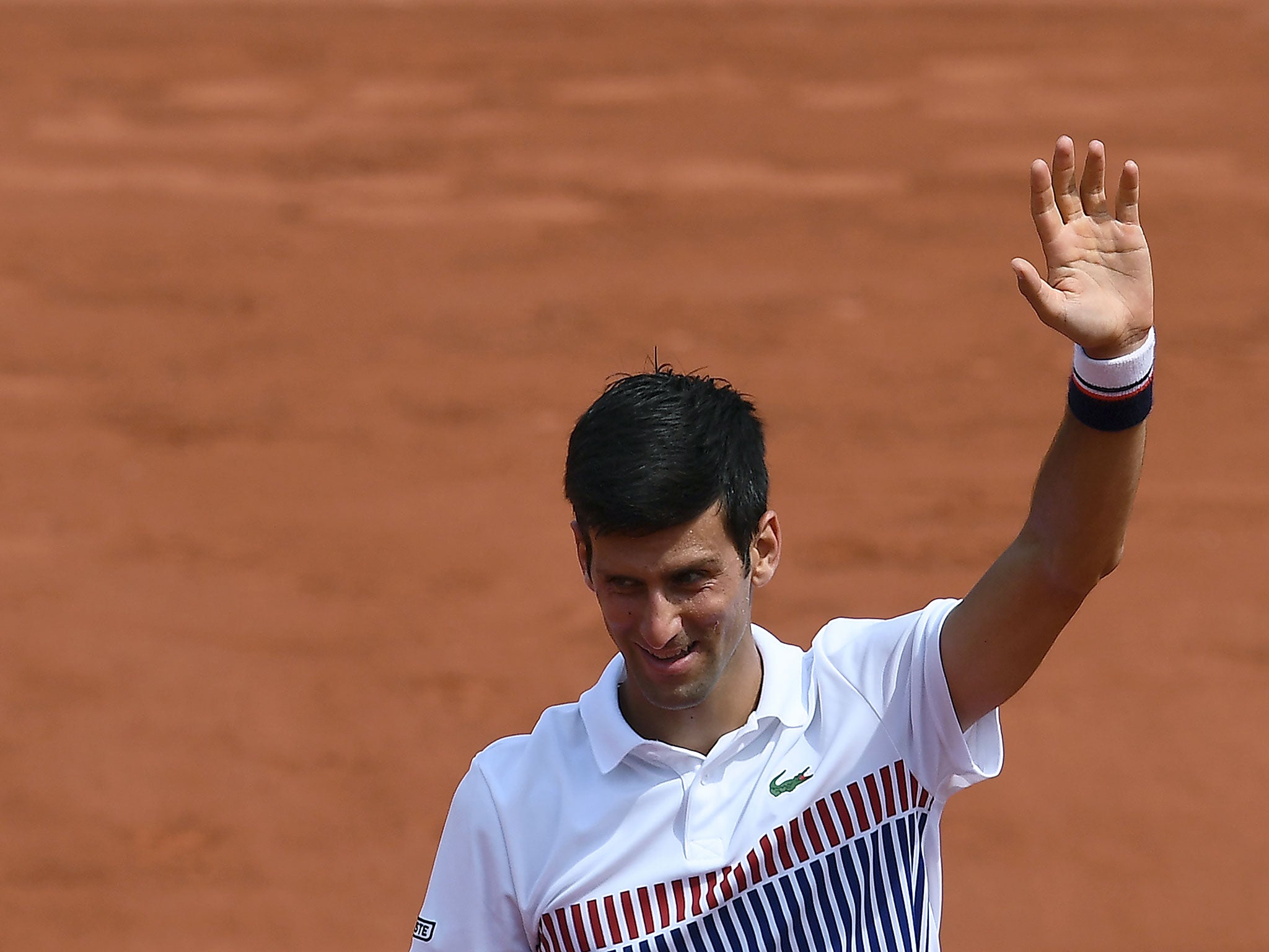 &#13;
Djokovic acknowledges the crowd after securing victory &#13;