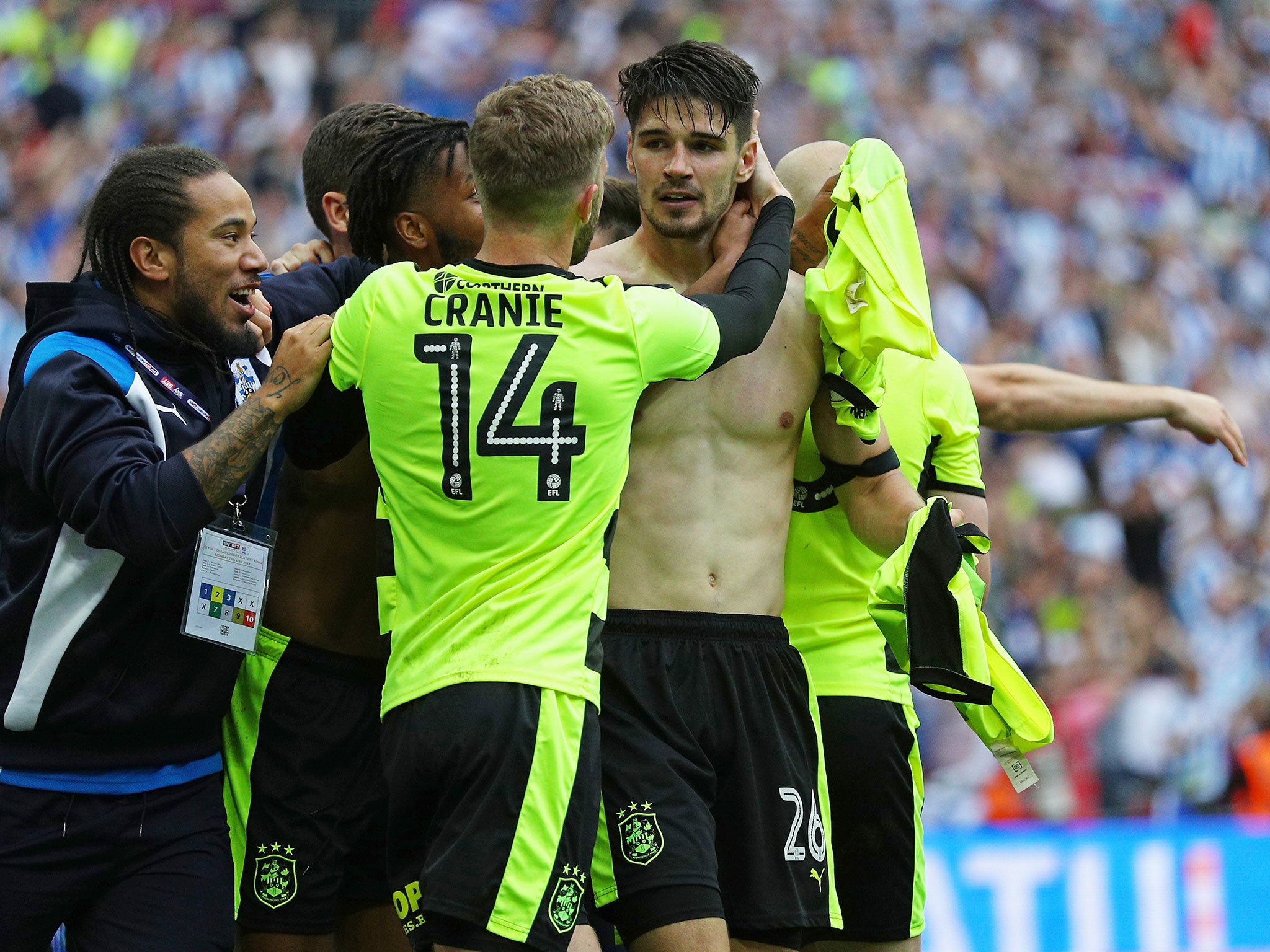 Christopher Schindler is congratulated by his teammates after the winning penalty