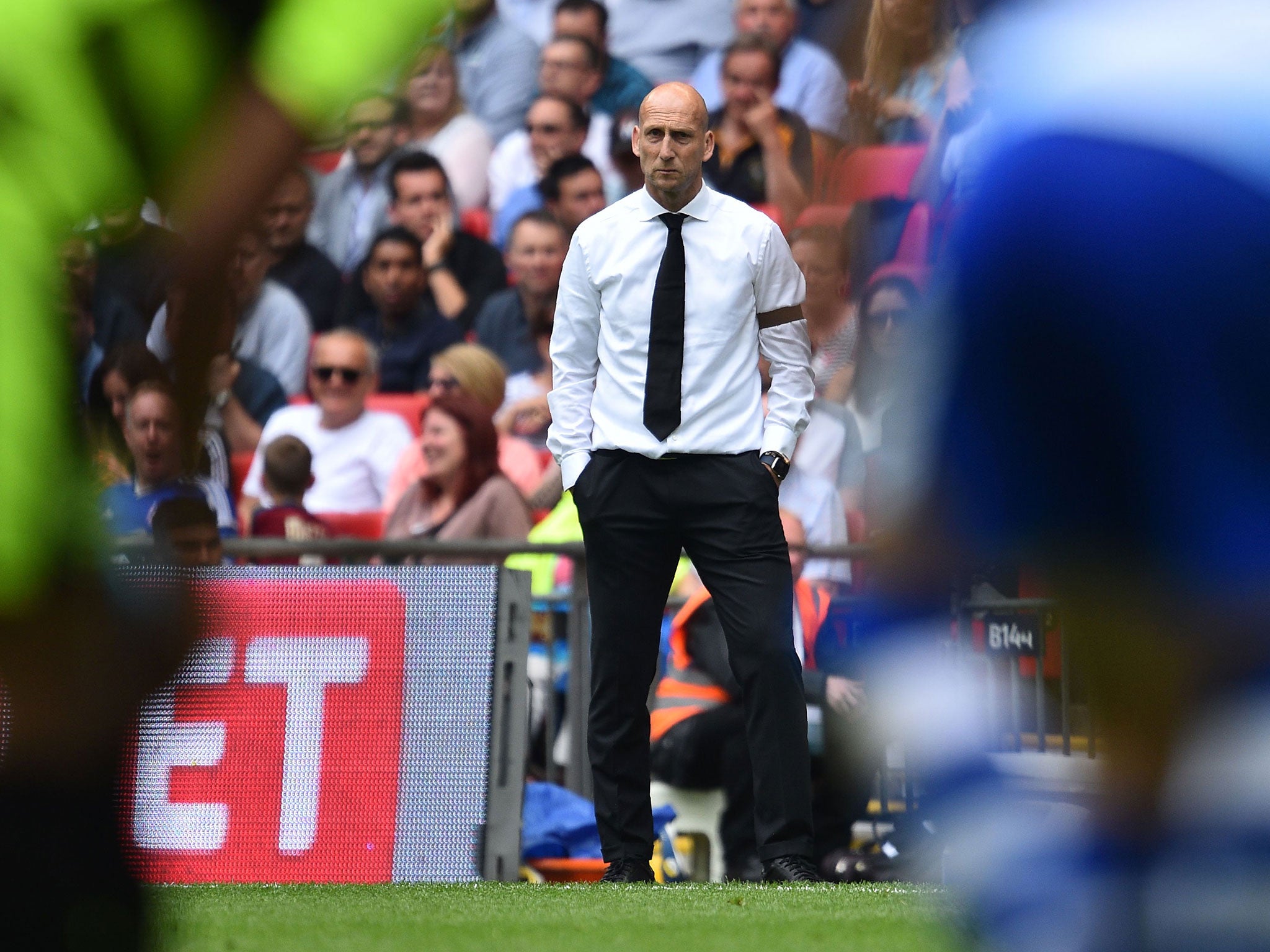 Jaap Stam looks on from the Wembley sideline