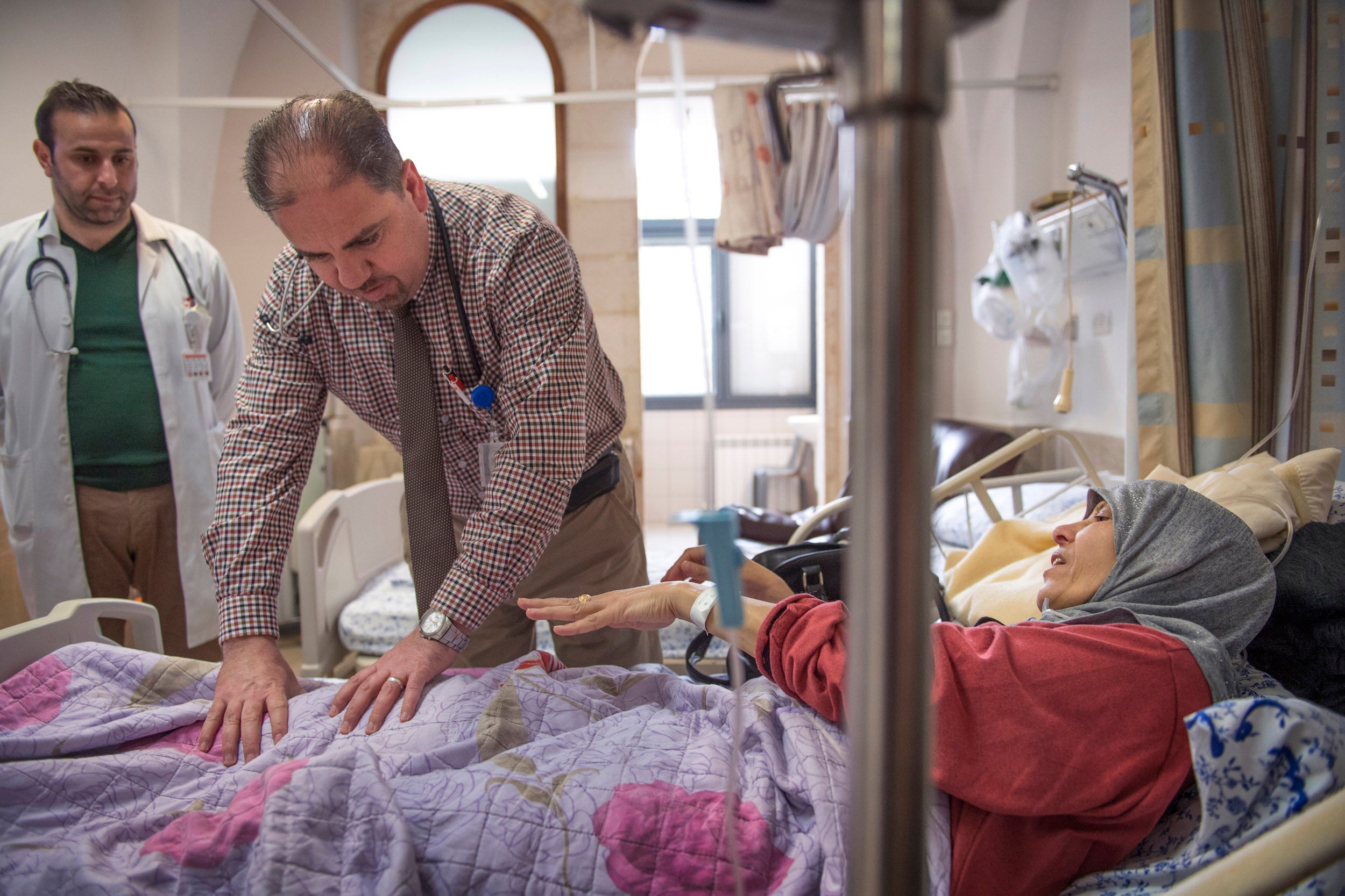 TLC: oncologist Yousef Hamamreh tends to Maweya Abu Salah in early April in her final visit to an East Jerusalem hospital