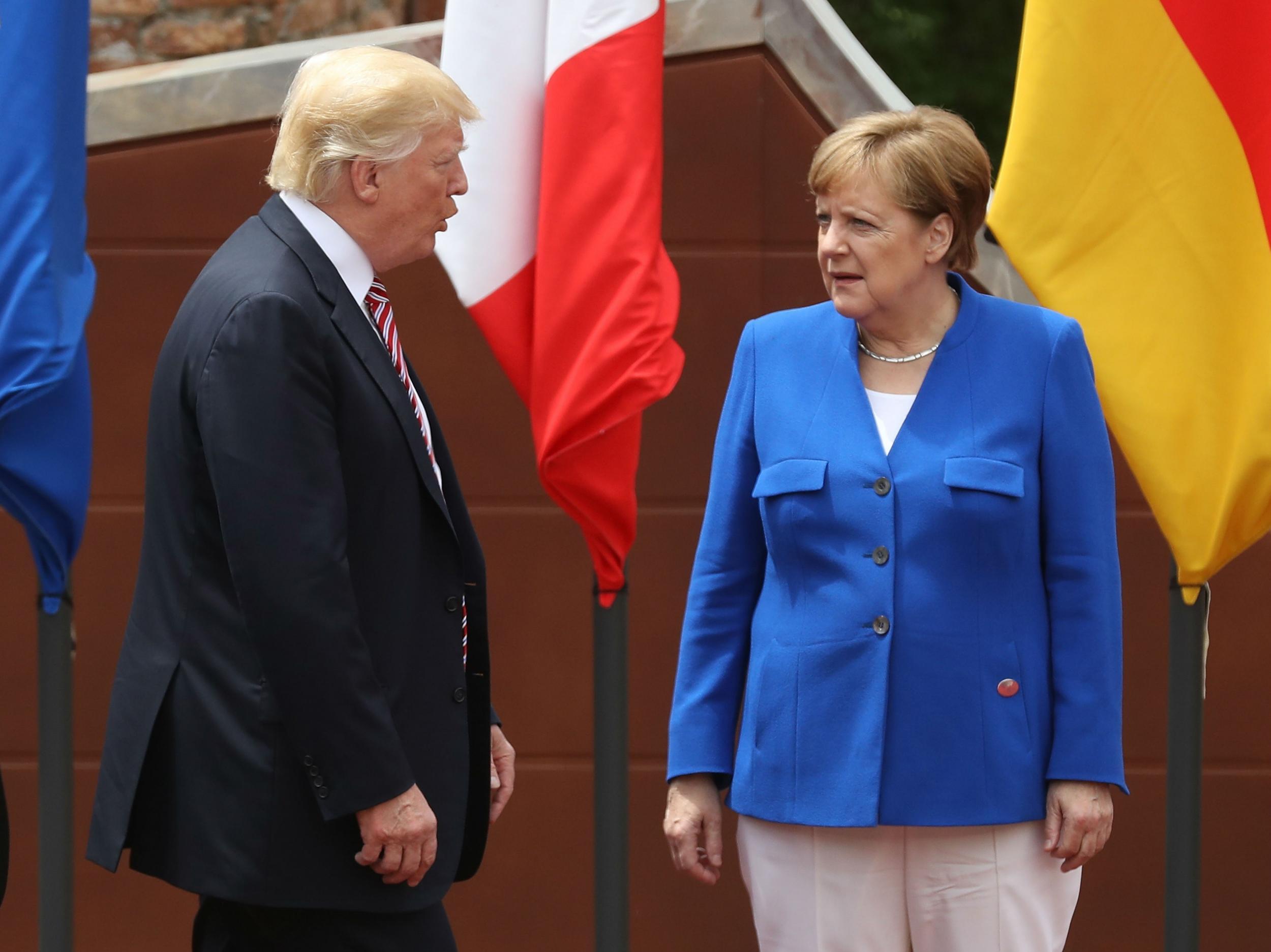 Donald Trump and German Chancellor Angela Merkel meet during the Group of Seven (G7) meeting in Taormina, Italy