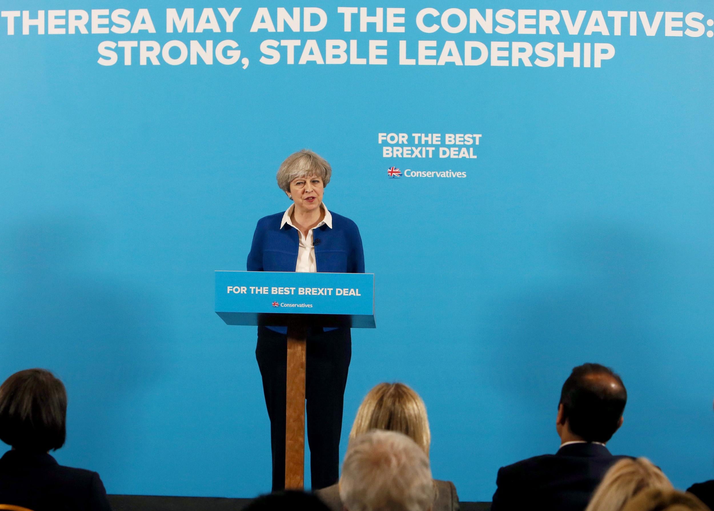 The word Conservatives, in large letters behind Theresa May's head, has scarcely been seen before now