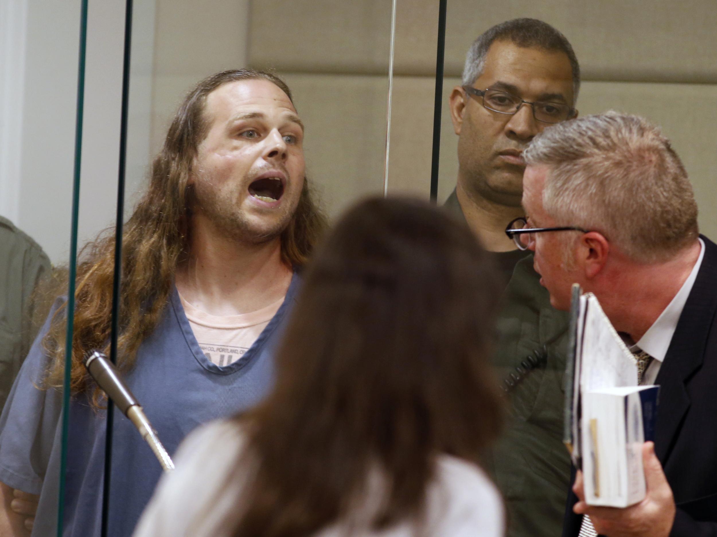 Jeremy Joseph Christian shouts as he is arraigned in Multnomah County Circuit Court in Portland