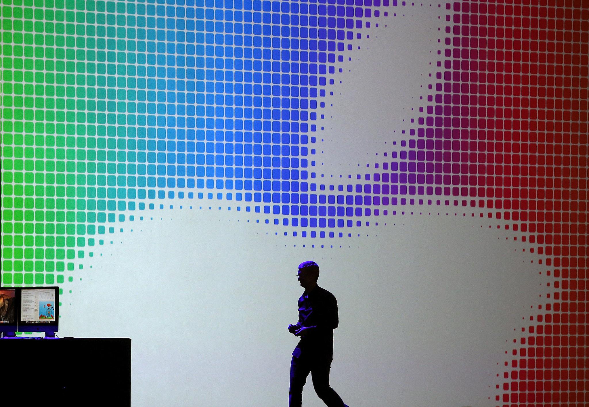 Apple CEO Tim Cook walks off stage after speaking during the Apple Worldwide Developers Conference at the Moscone West centre