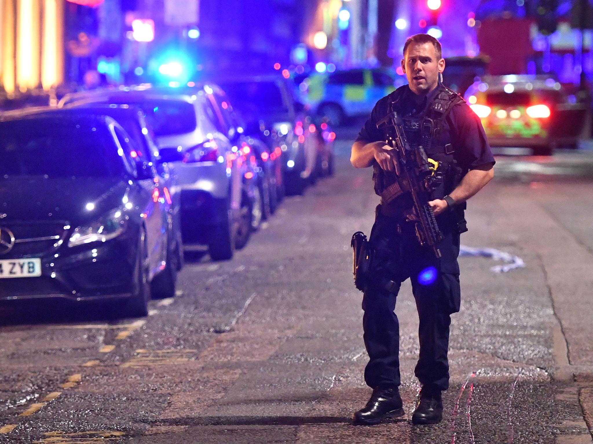 Armed police on Borough High Street as police are dealing with a "major incident" at London Bridge
