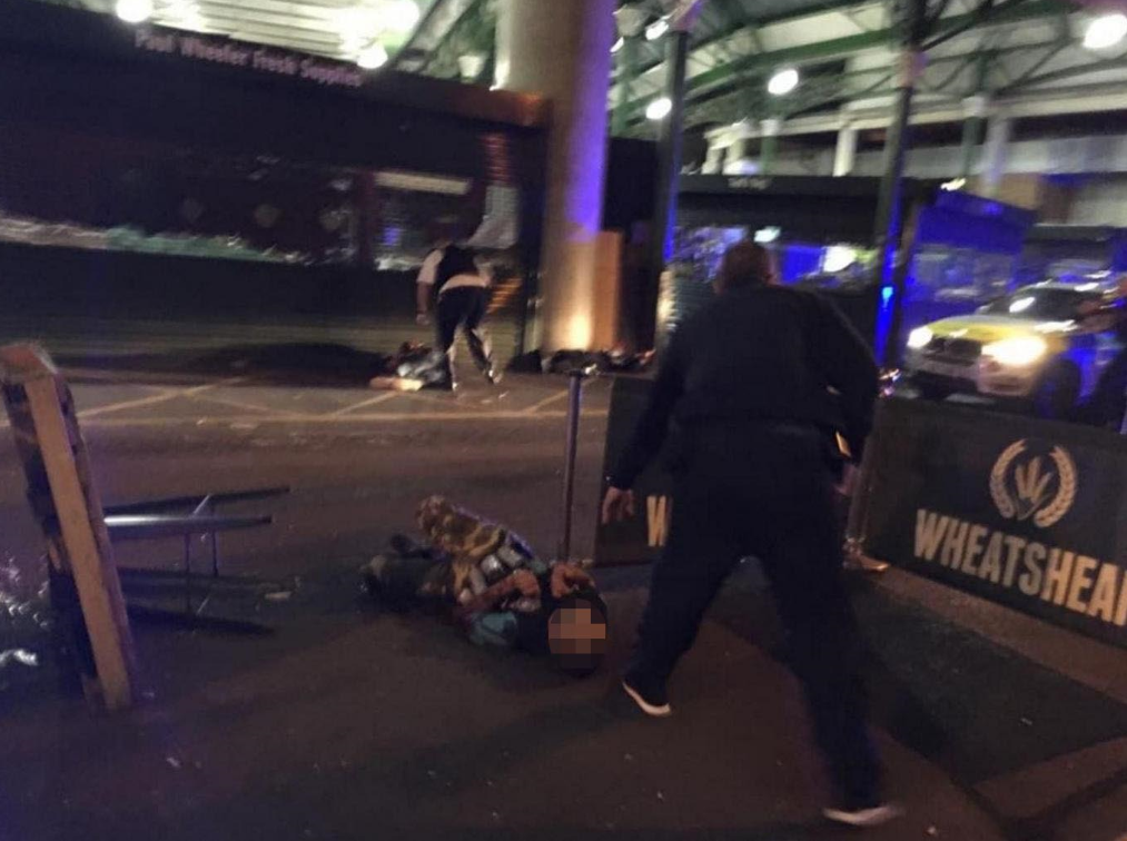 Image shows two men lying on the ground after having reportedly been shot by the police in what is believed to be linked to terrorist attacks in the centre of London