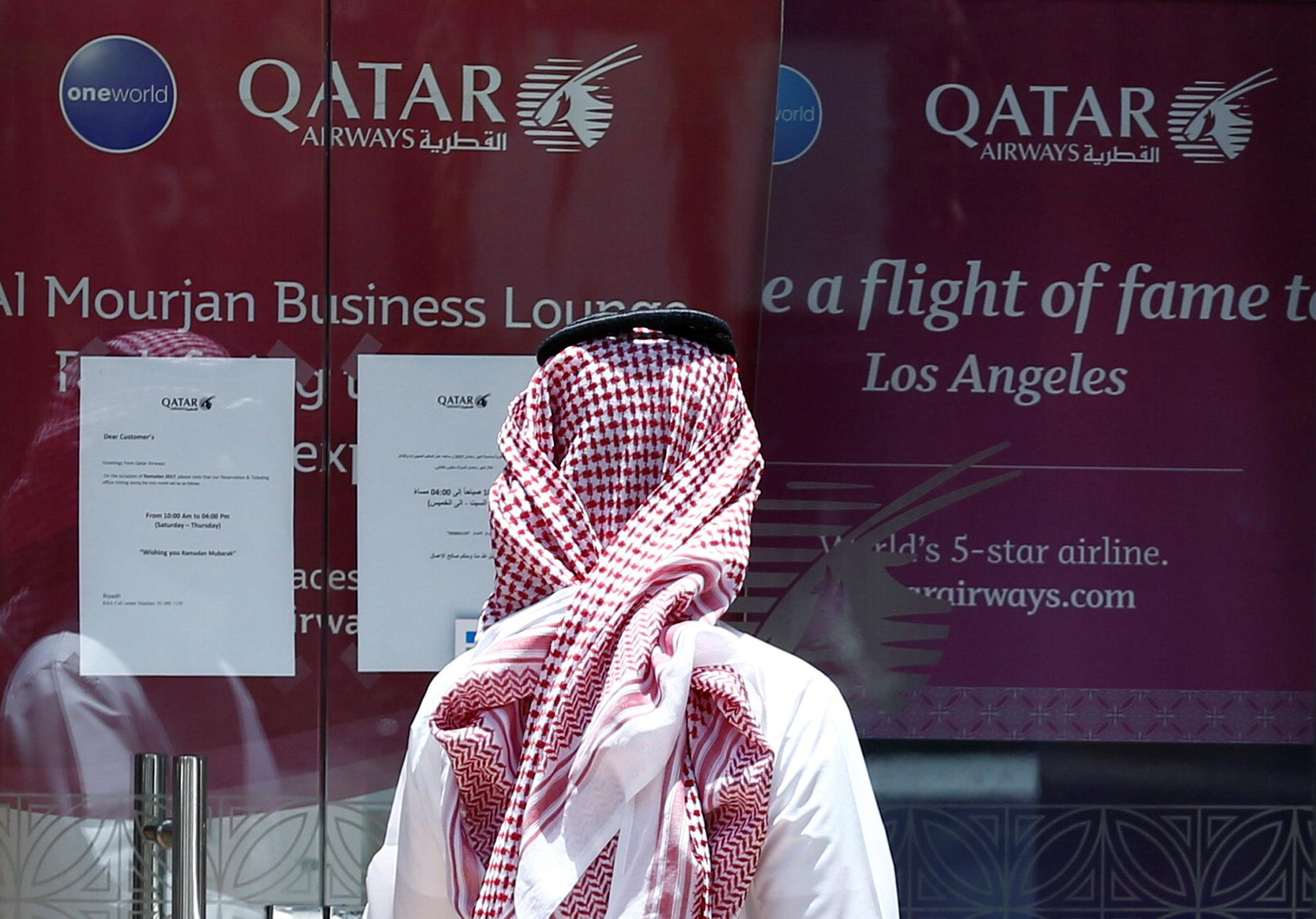 A man stands outside a Qatar Airways office in Riyadh, Saudi Arabia on 5 June 2017