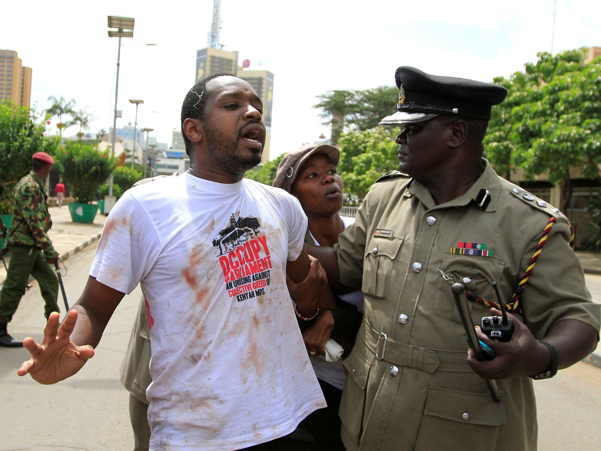 &#13;
Mwangi being detained during a 2013 demonstration against MPs’ high salaries &#13;