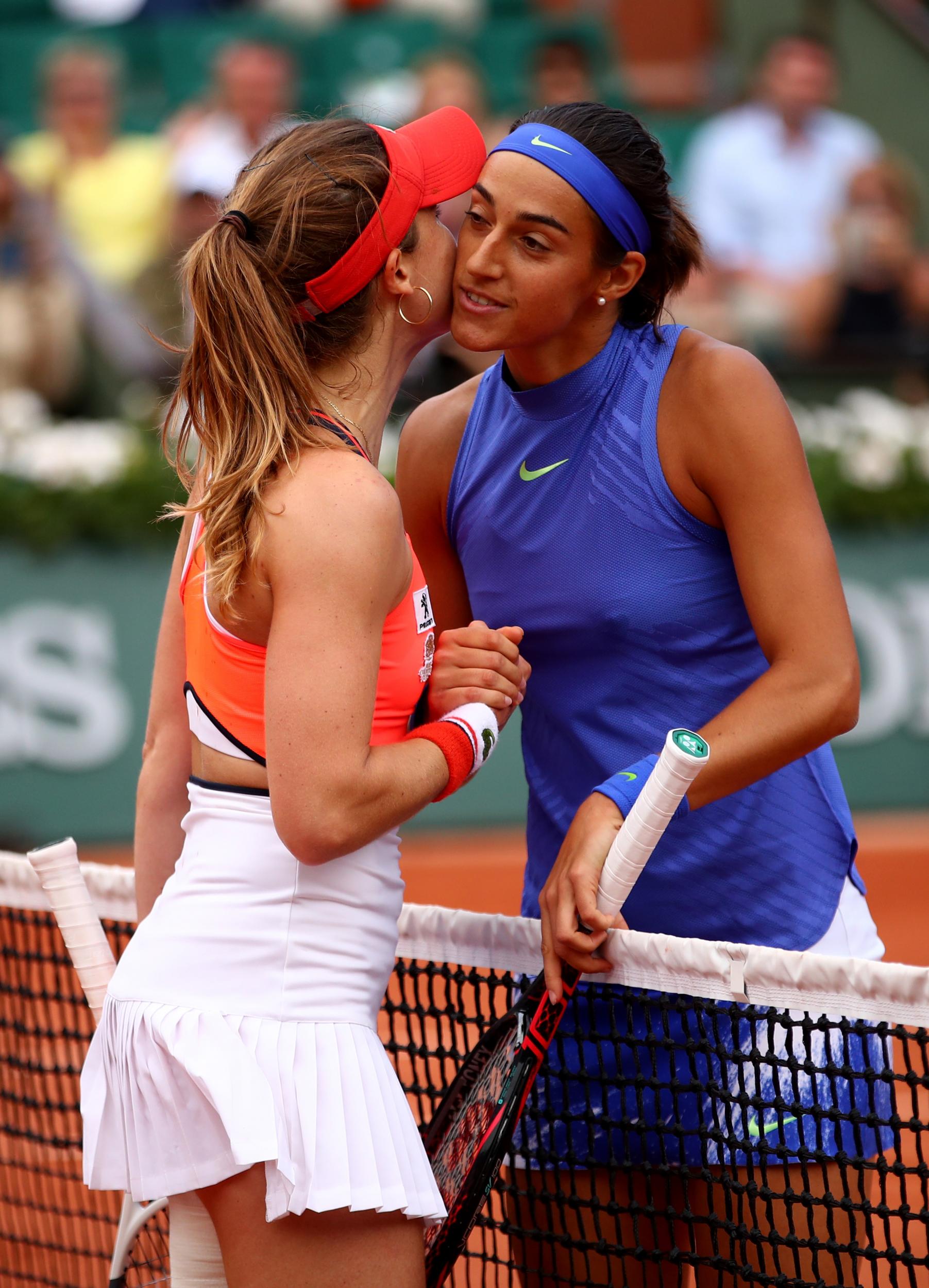 The pair exchanged a frosty kiss at the net