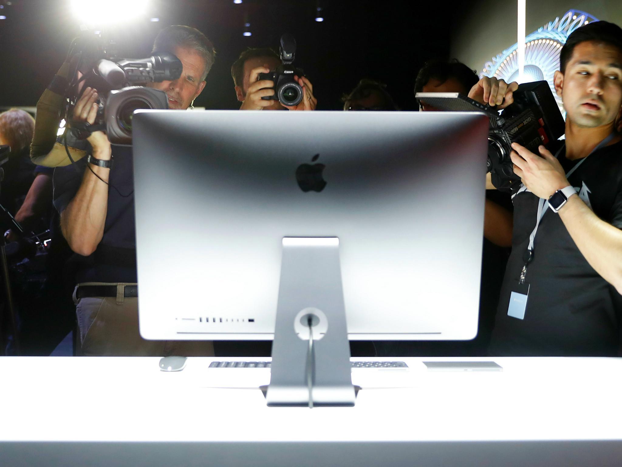Members of the media photograph a prototype iMac Pro during the annual Apple Worldwide Developer Conference (WWDC) in San Jose, California, U.S. June 5, 2017