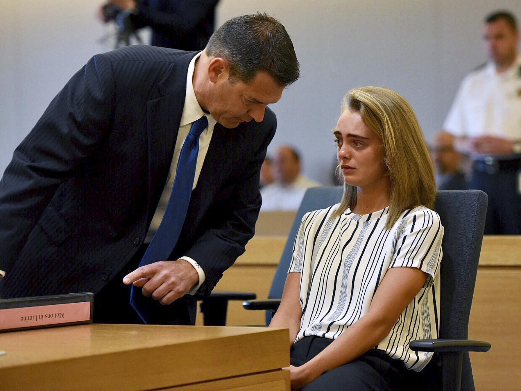 Defence lawyer Joseph Cataldo talks to his client, Michelle Carter, (AP)