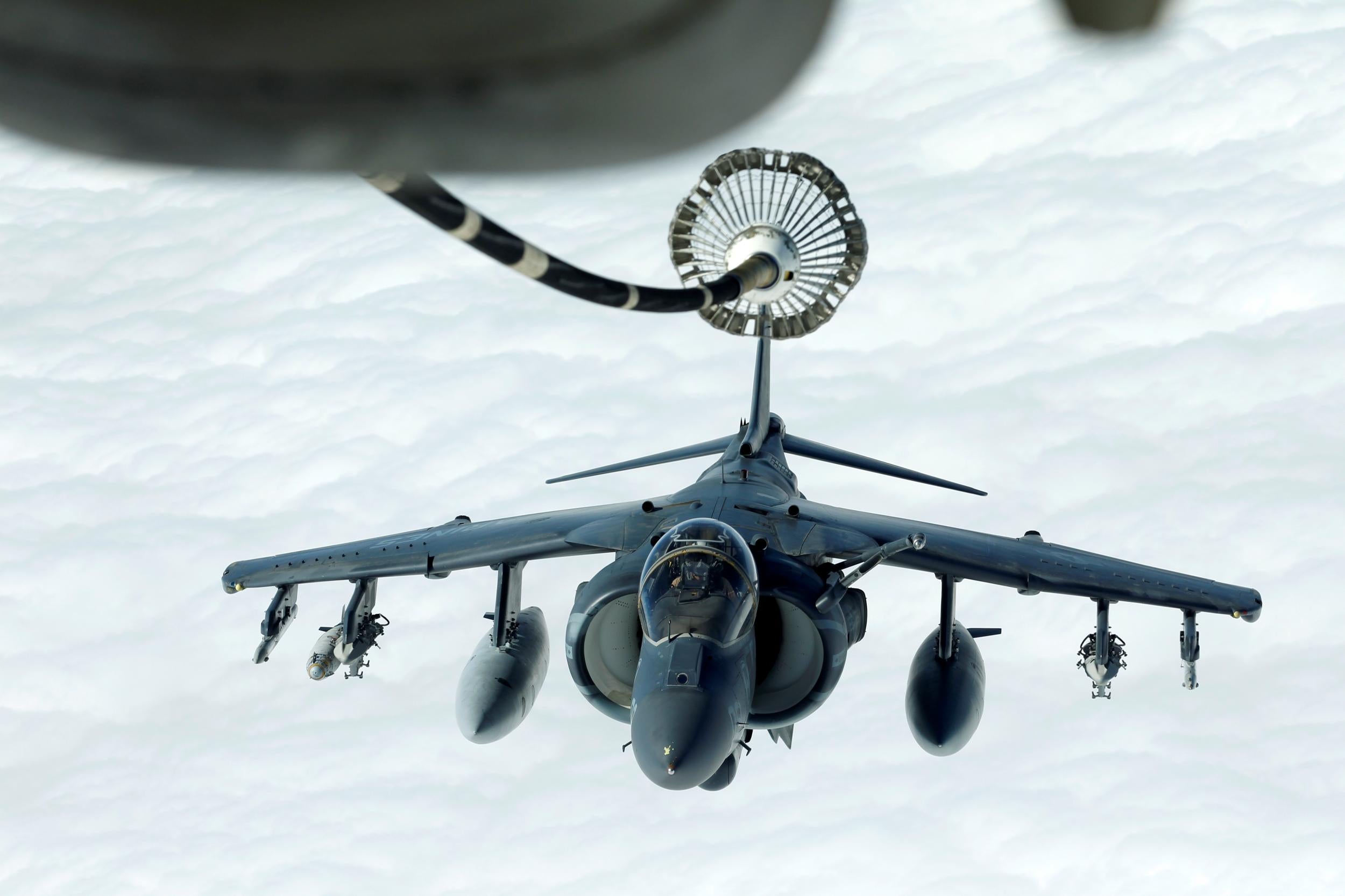 A US Marines Harrier AV-8B makes its way to a fuelling boom suspended from a KC-10 Extender during mid-air refuelling support to Operation Inherent Resolve over Iraqi and Syrian air space, 15 March 2017