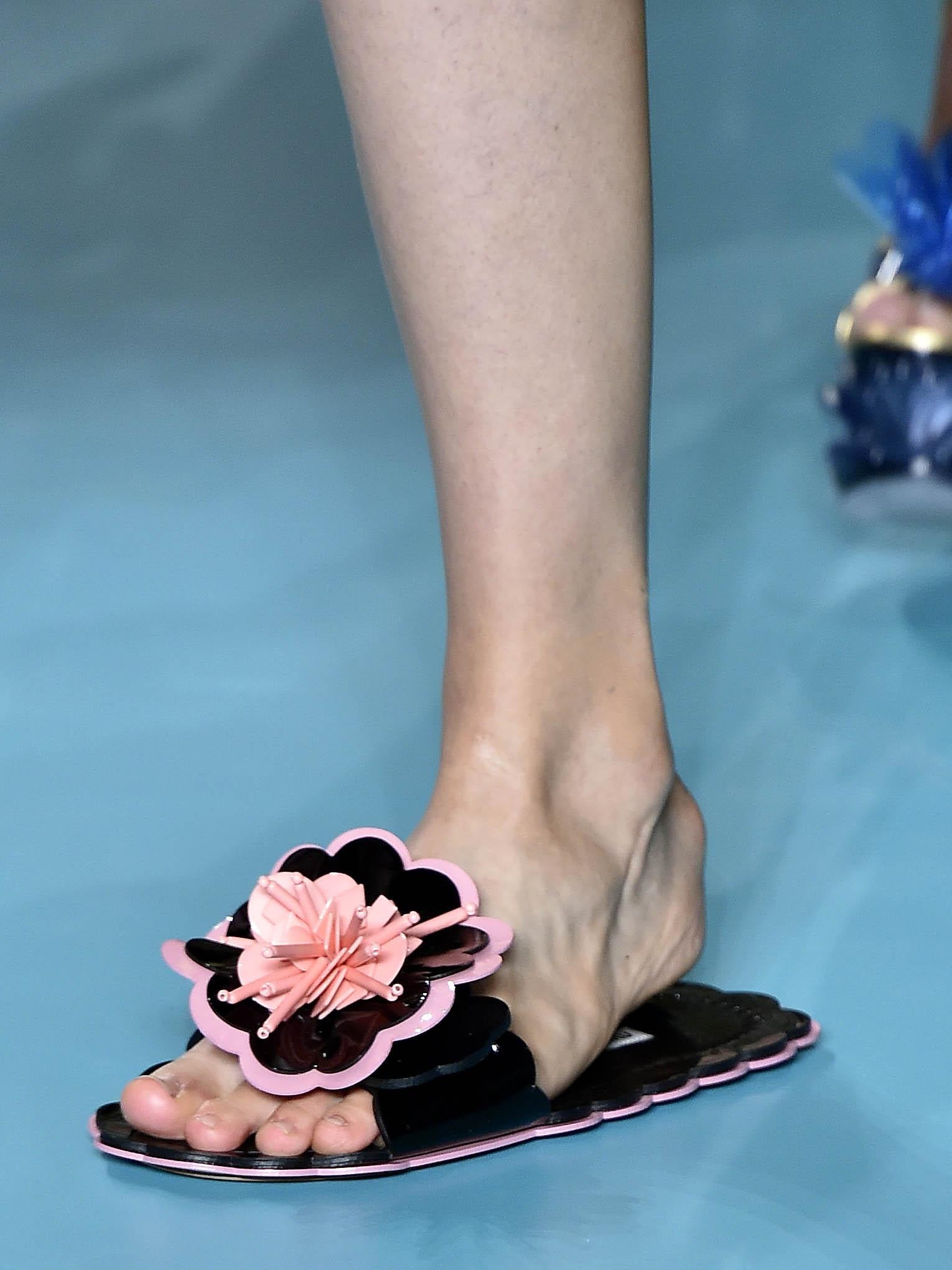 Miu Miu showcased its retro seaside-inspired collection with plastic beach slides