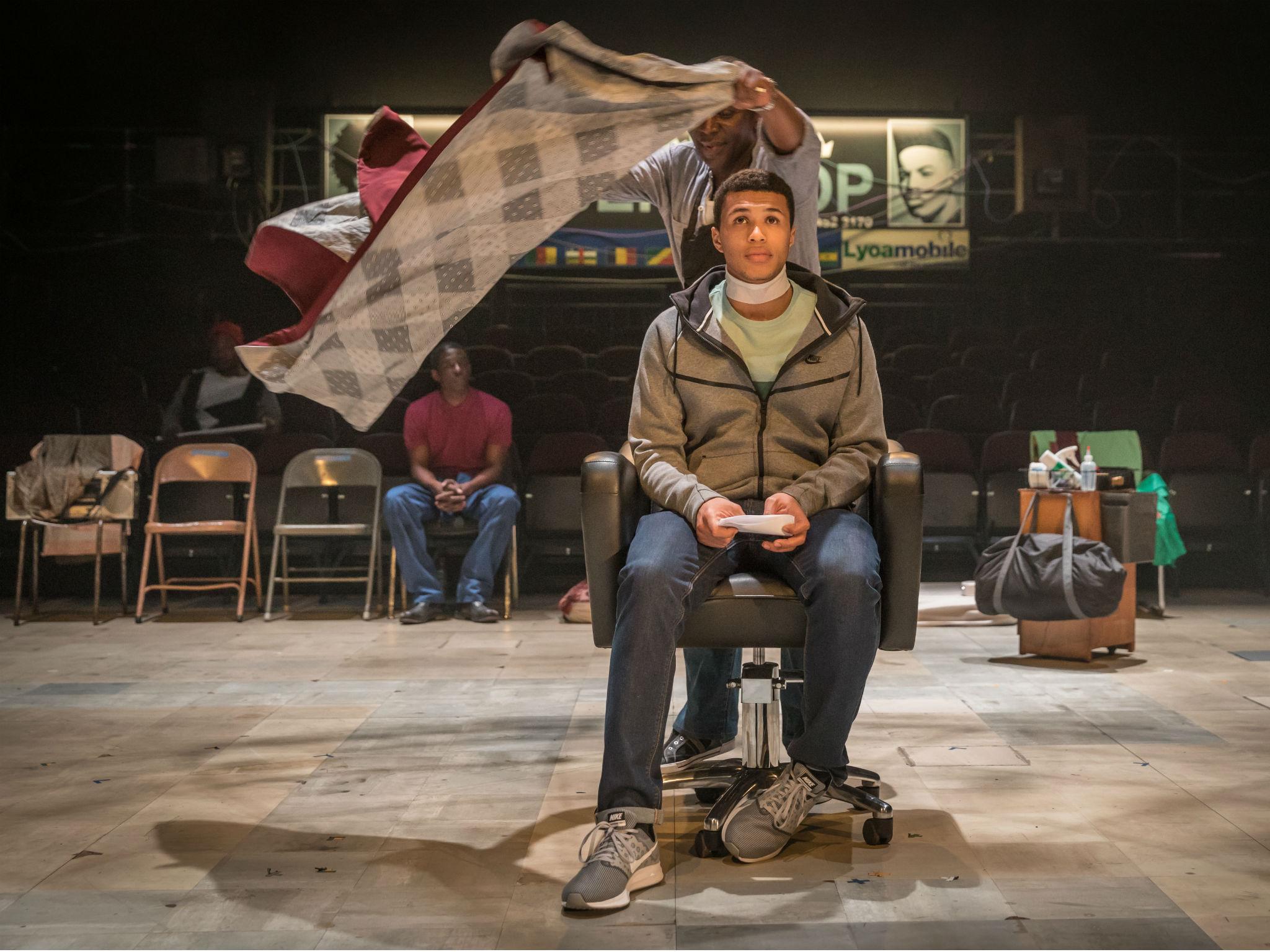 Cyril Nri as Emmanuel and Kwami Odoom as Ethan in 'Barber Shop Chronicles' at the National Theatre