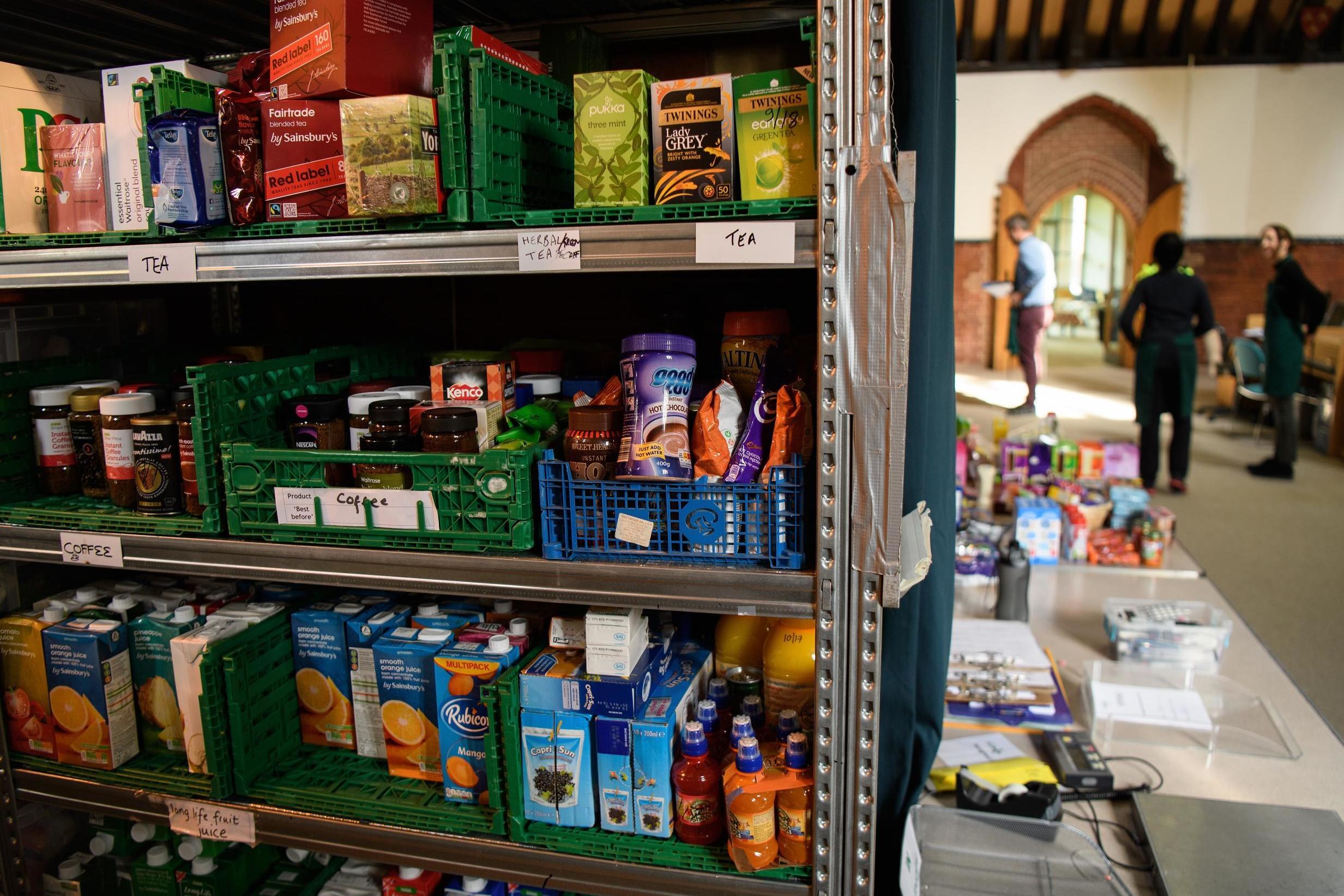 Volunteers at the Trussell Trust's Wandsworth foodbank prepare parcels for guests from their stores of donated food, toiletries and other items