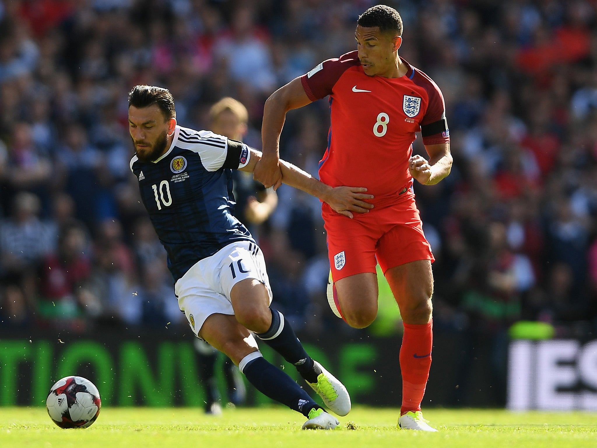 Robert Snodgrass and Jake Livermore battle for the ball at Hampden Park