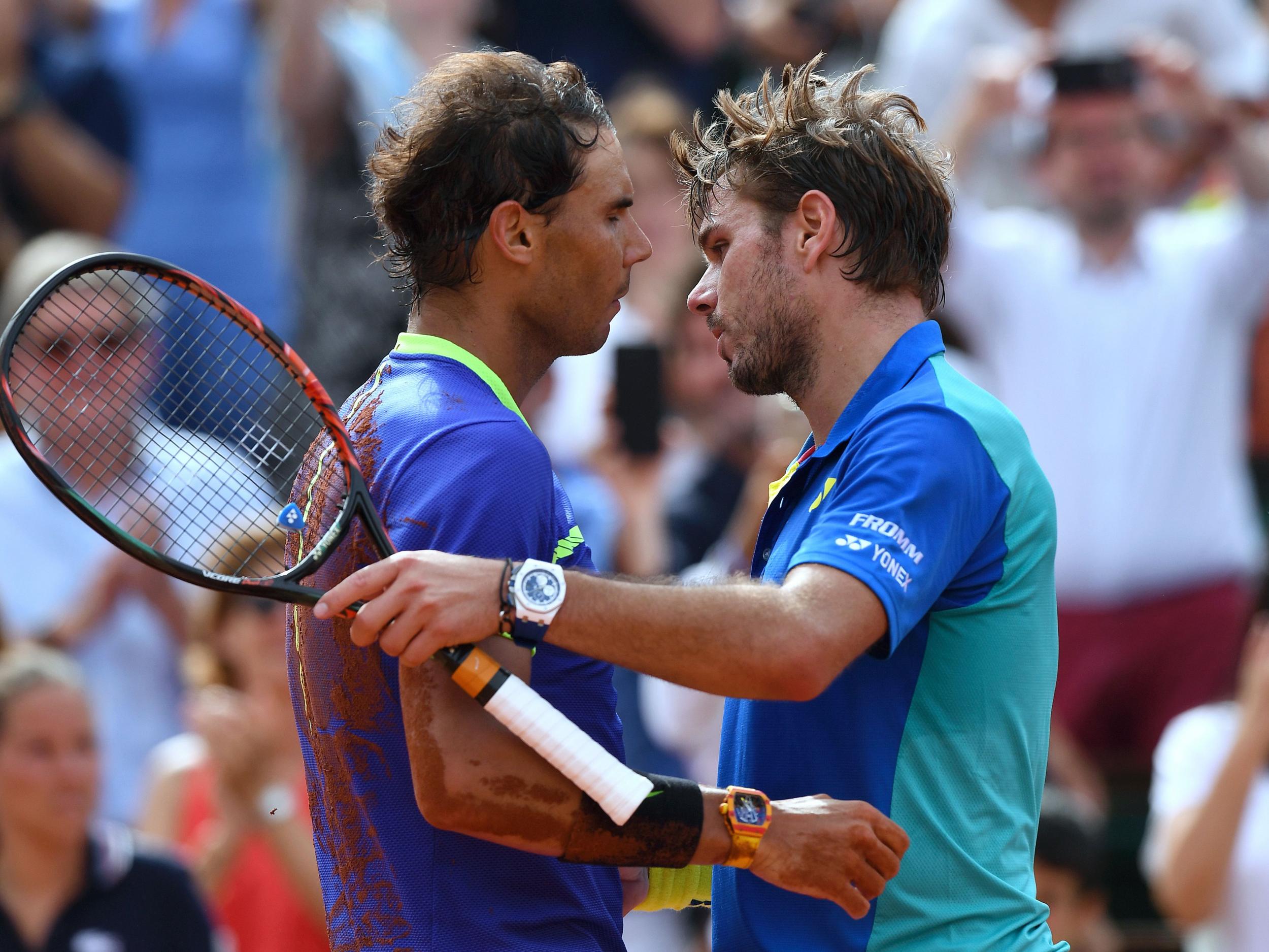 Nadal and Wawrinka embrace at the net